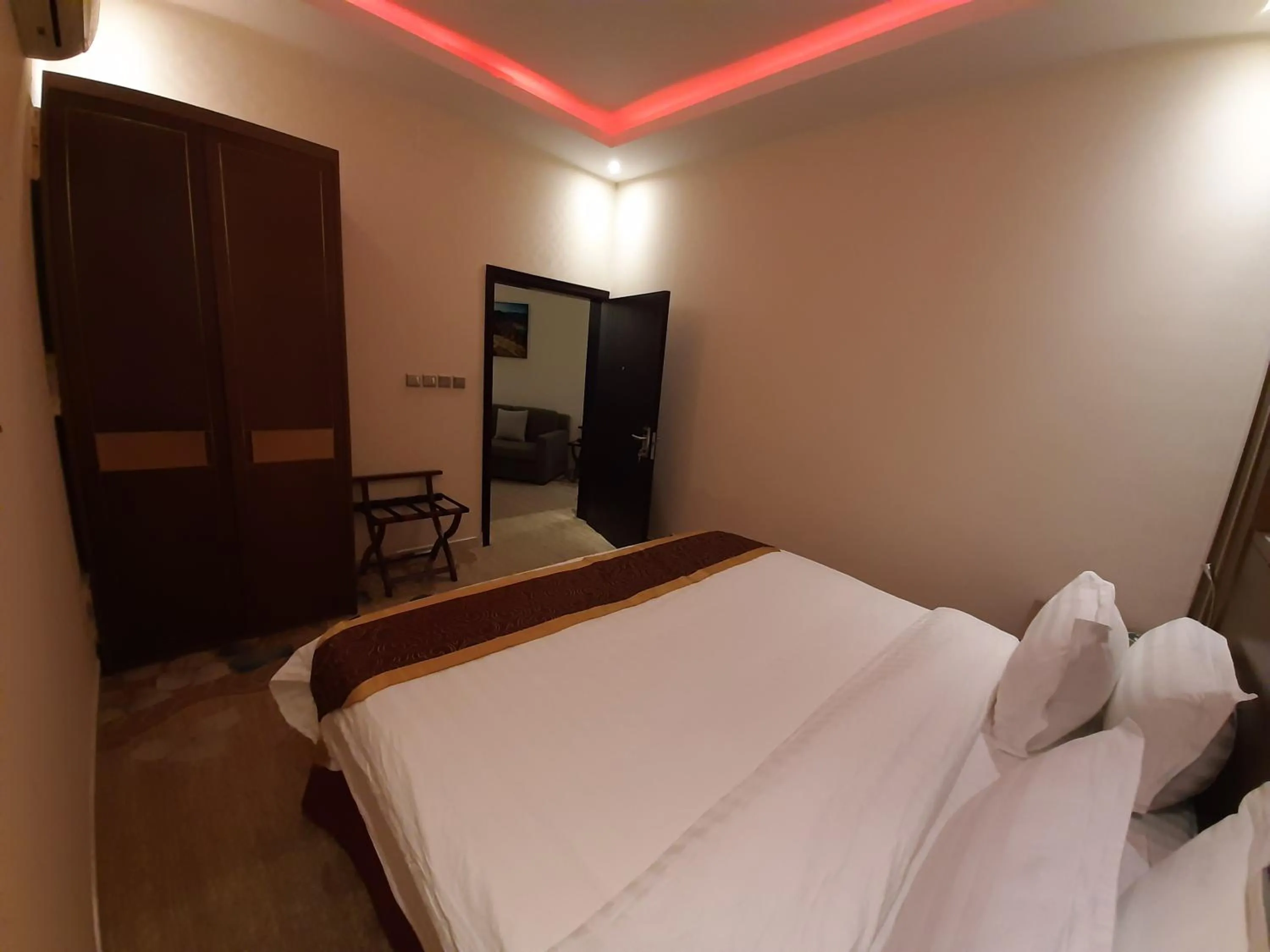 Bed in Qasr Alshamal Hotel