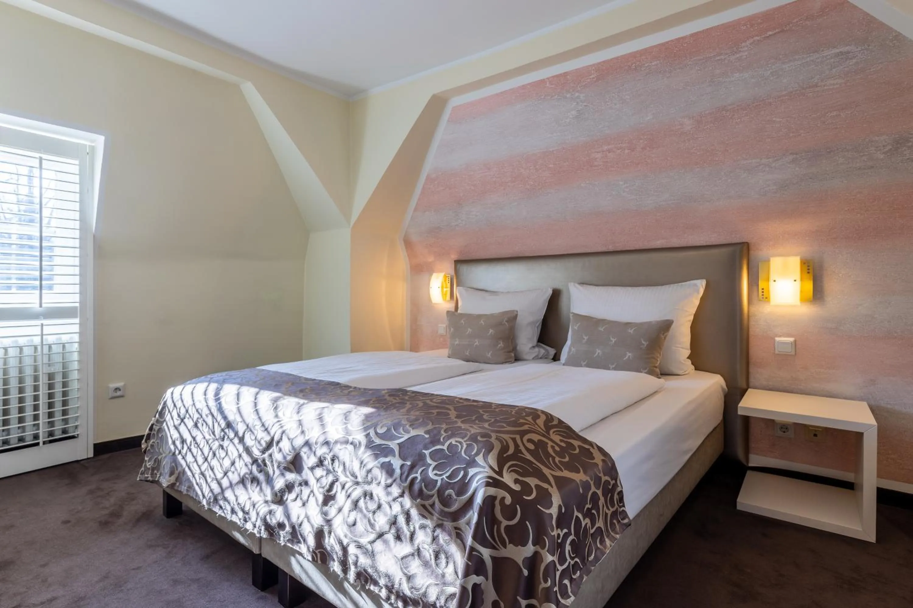 Bed in Jagdschloss Hotel Niederwald