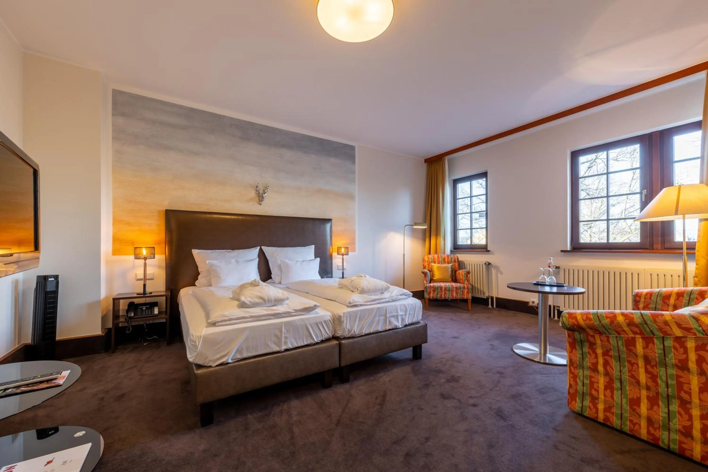 Photo of the whole room, Bed in Jagdschloss Hotel Niederwald