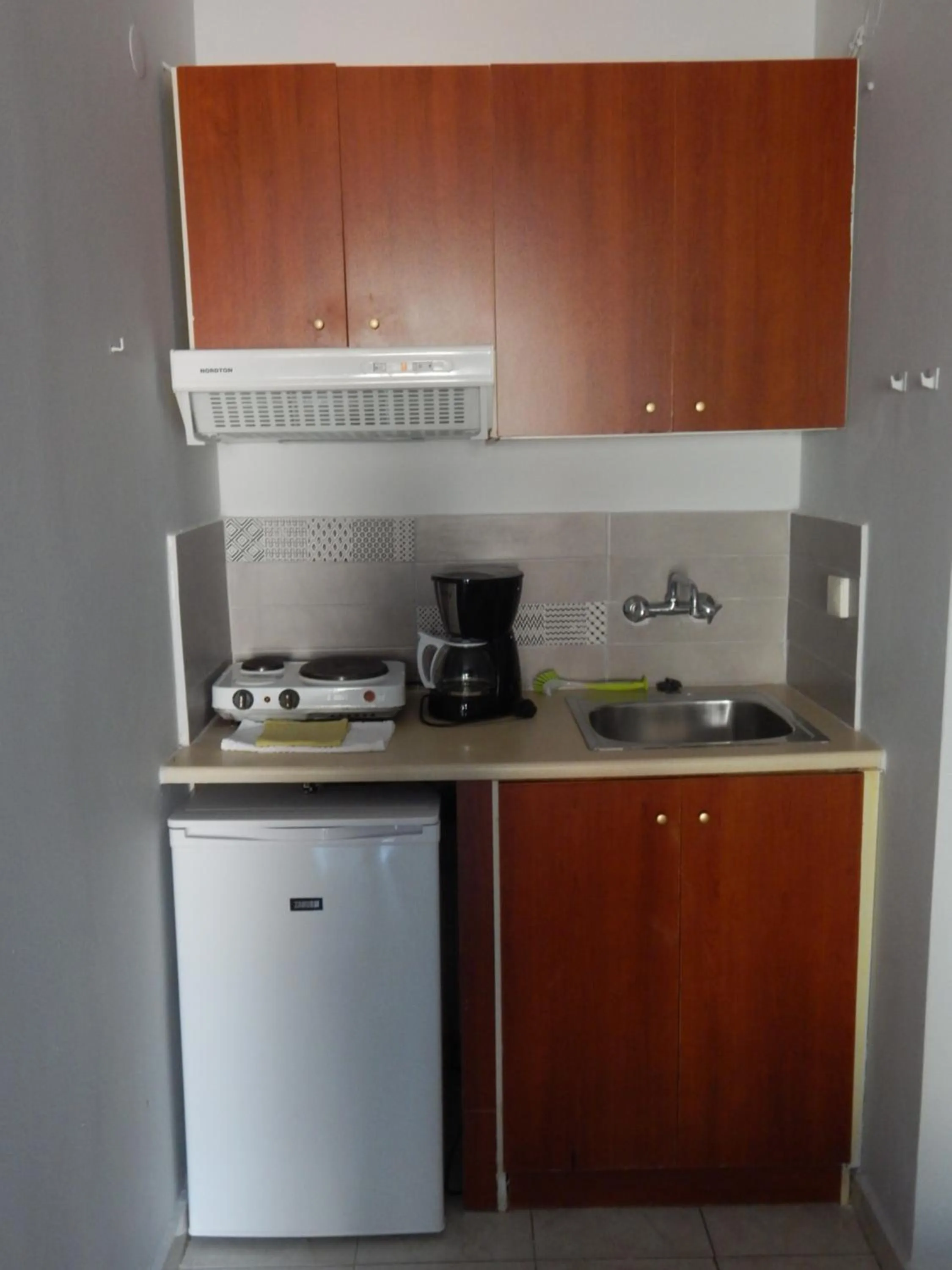 Kitchen or kitchenette in Posidonio Hotel