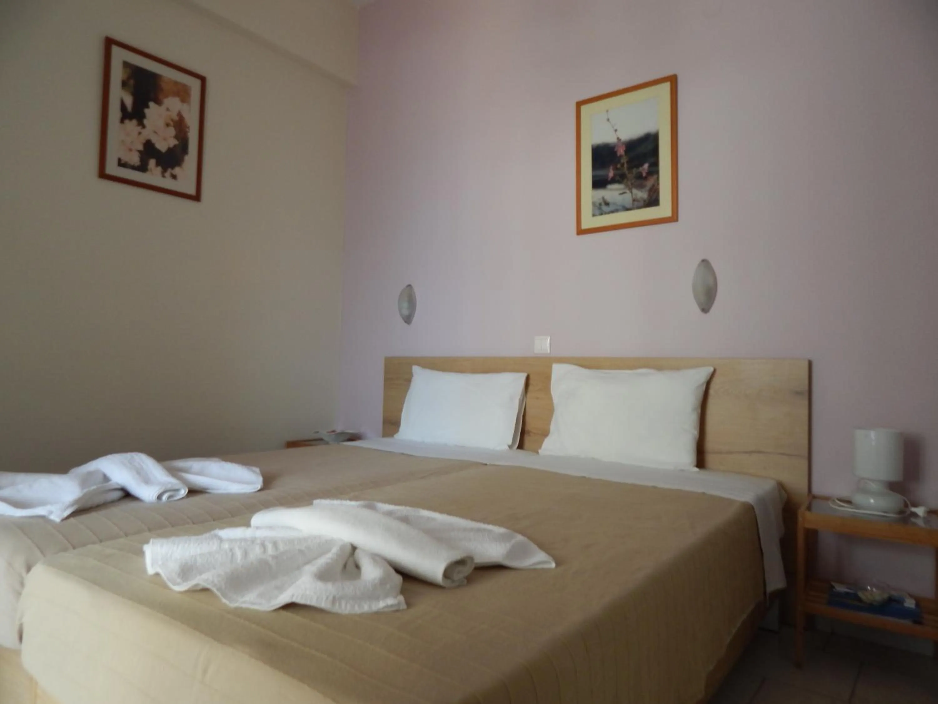 Bed in Posidonio Hotel