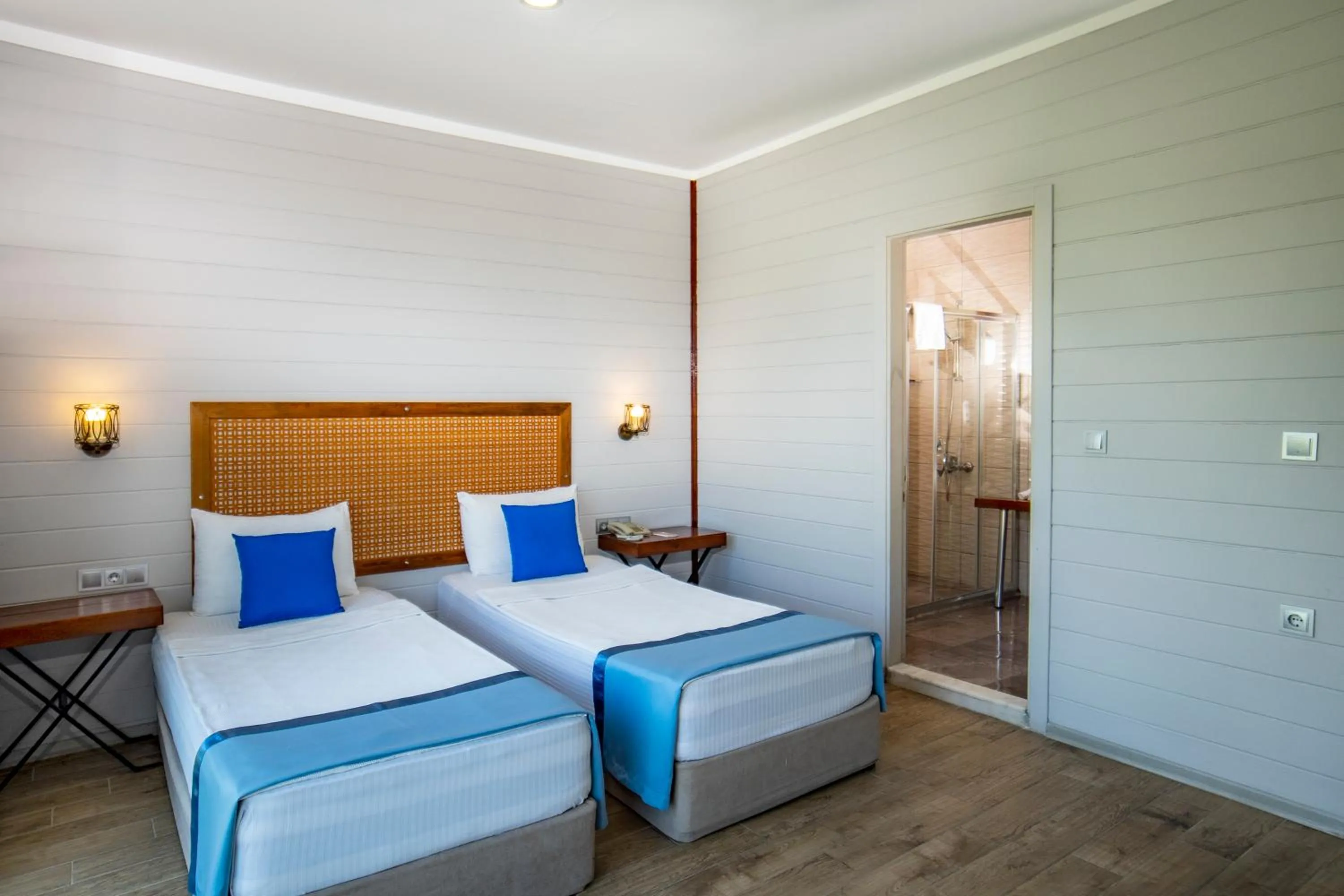 Bed in Risus Beach Resort Hotel