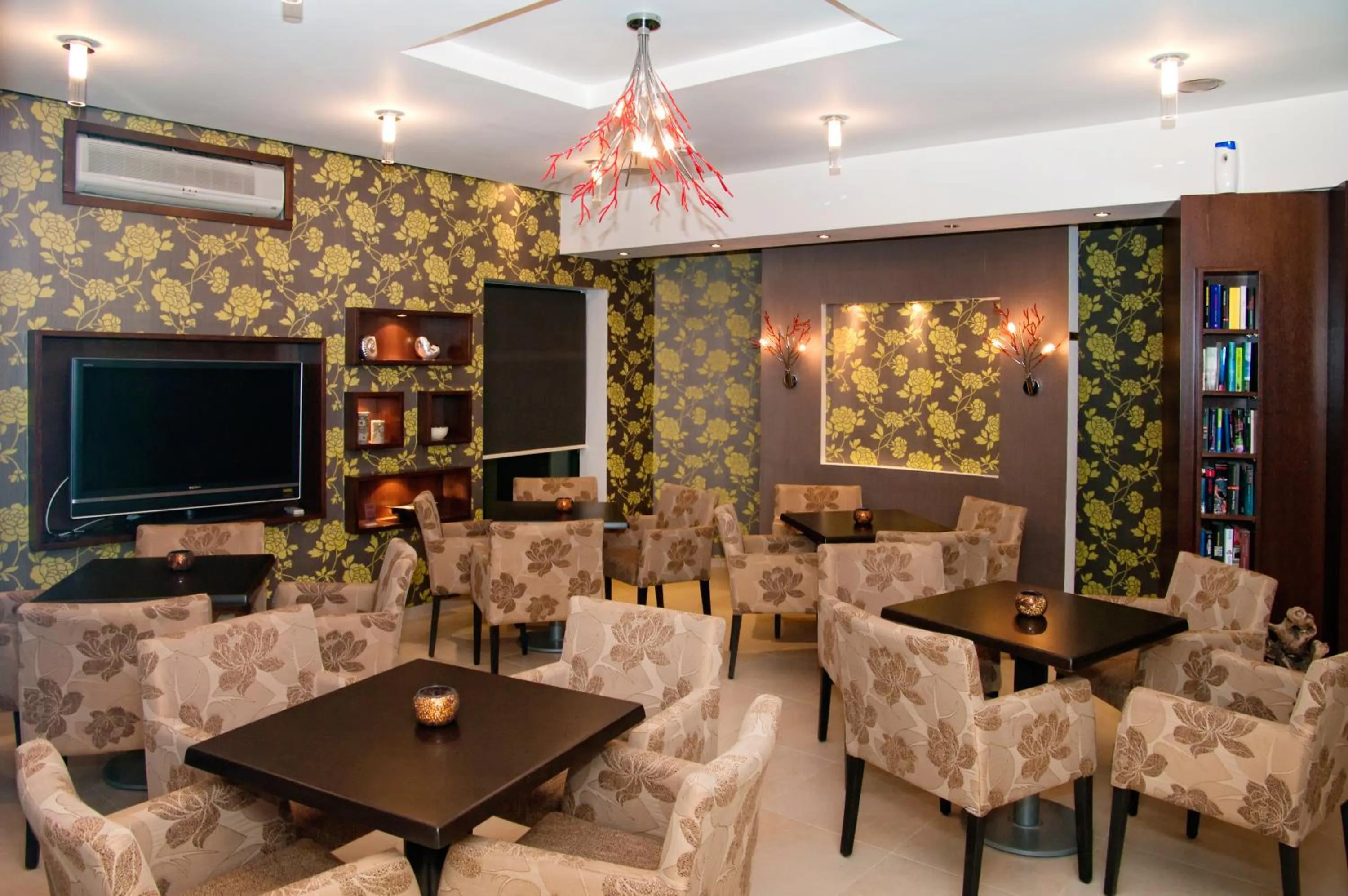 Communal lounge/ TV room in Nicolas Hotel