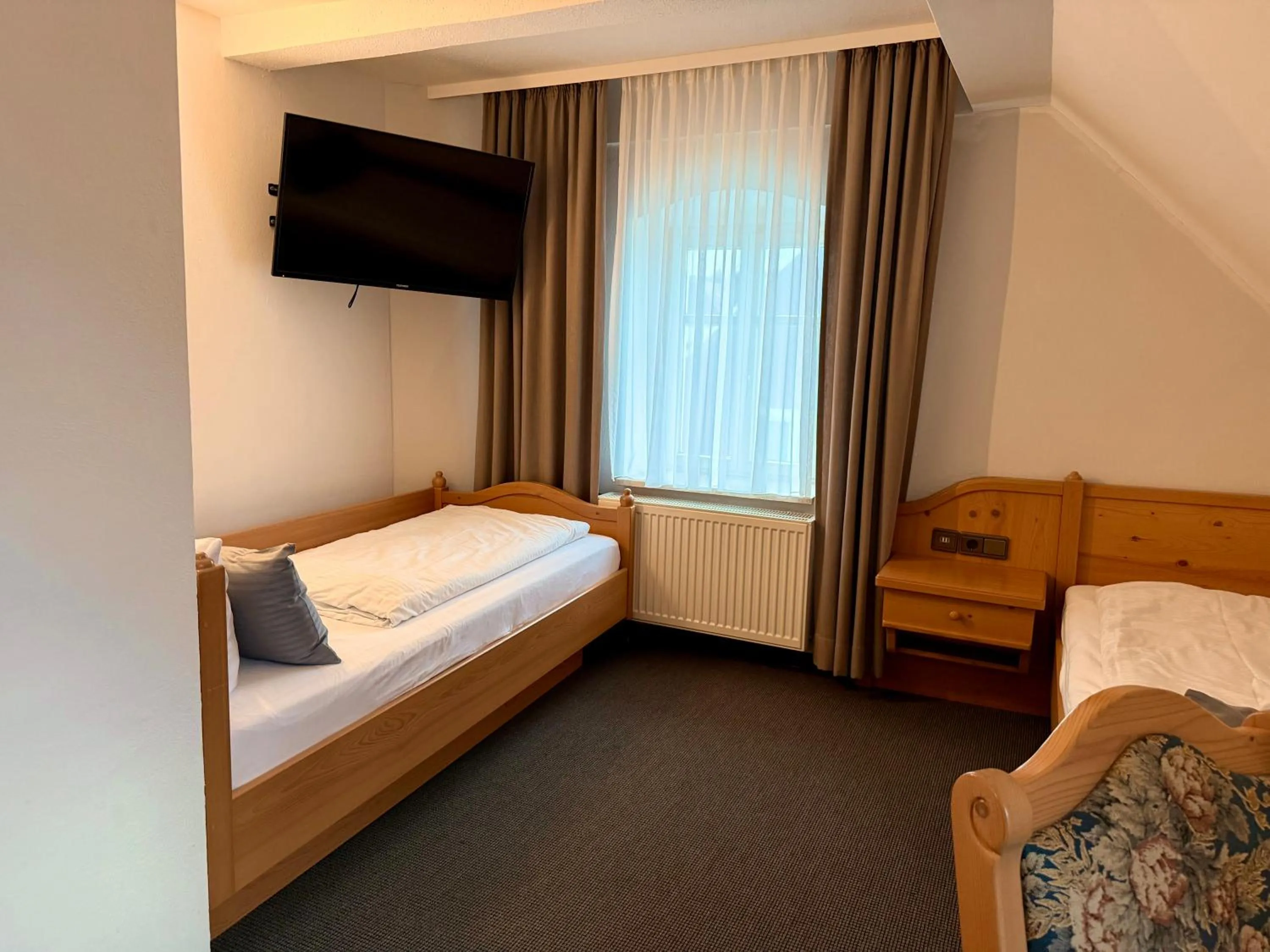 Bed in Gasthof Hotel Bräustübl und Haus Boutique