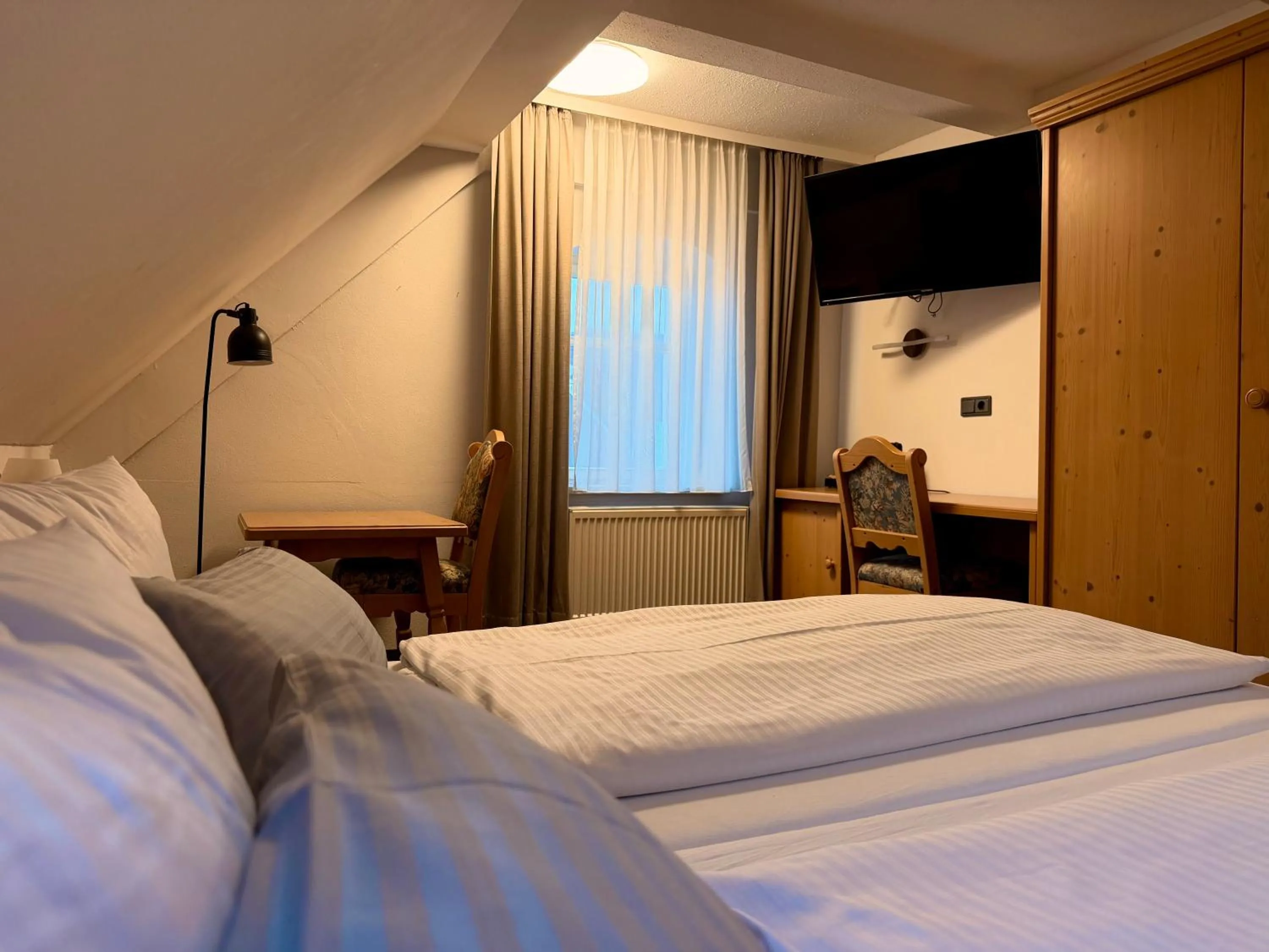 Bed in Gasthof Hotel Bräustübl und Haus Boutique