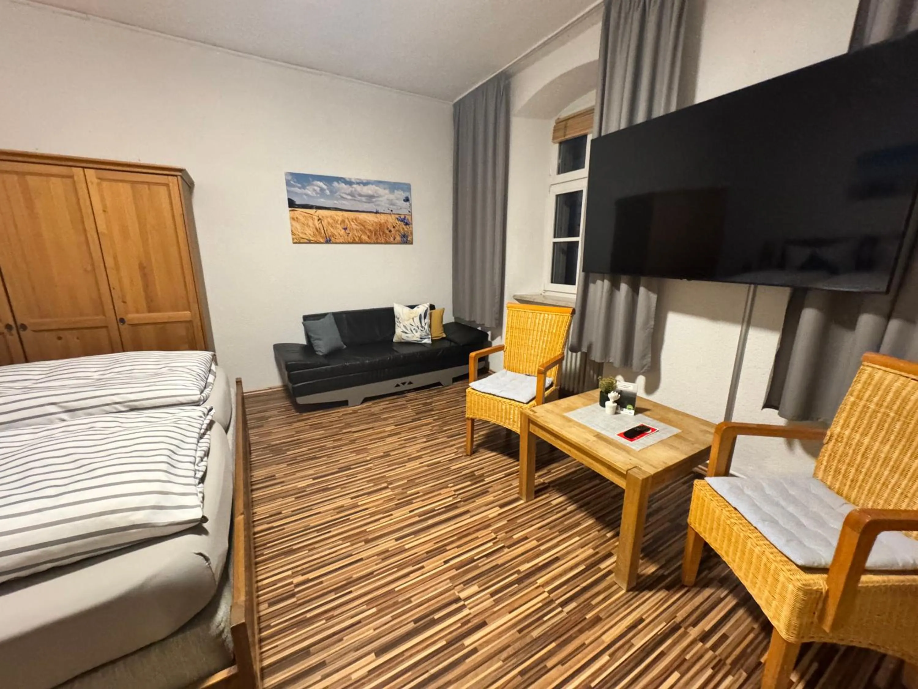 Living room, Bed in Gasthof Hotel Bräustübl und Haus Boutique