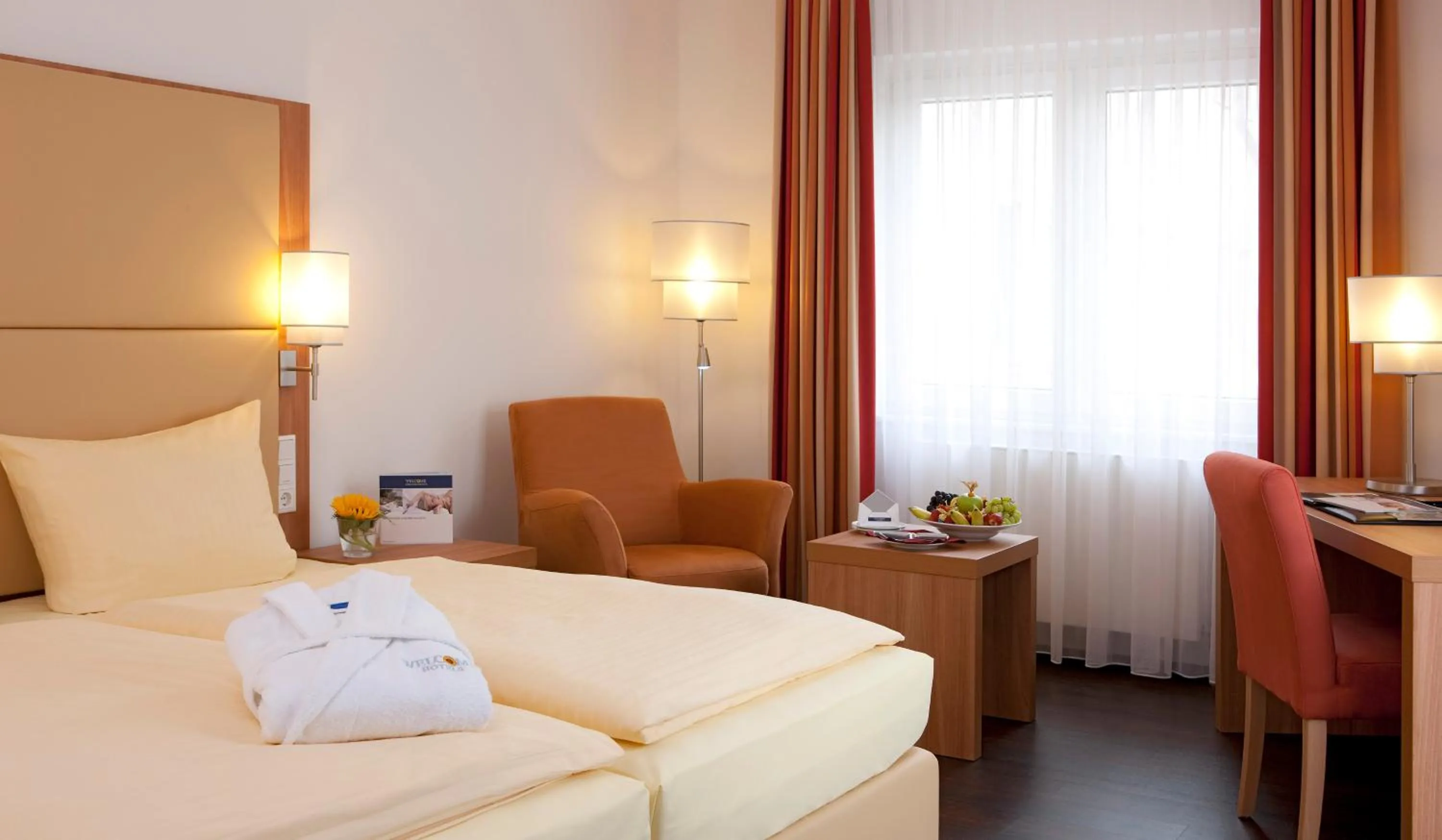 Living room, Bed in Welcome Hotel Marburg