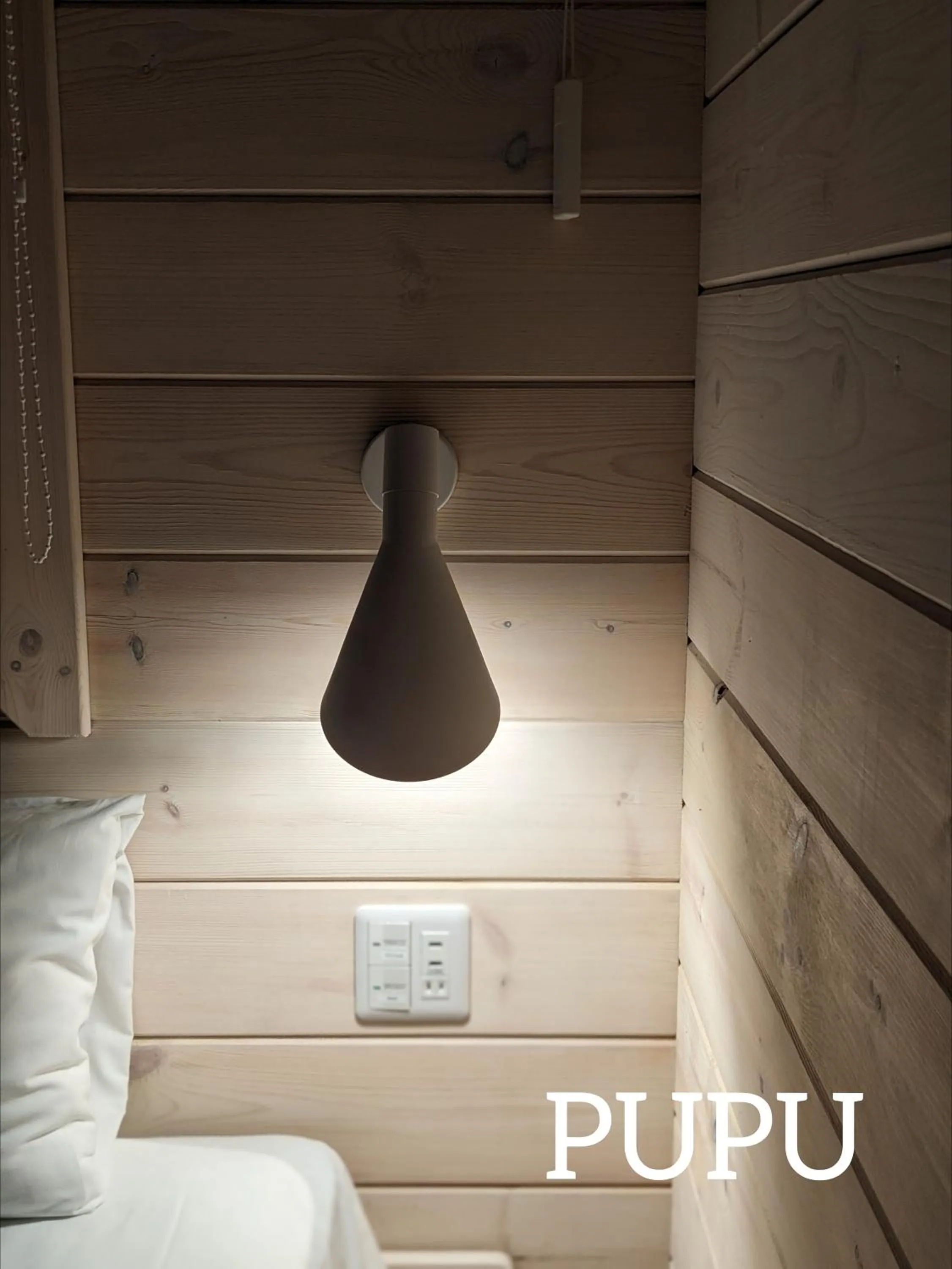 Bed in Log cabin rentals & Finland sauna Step House