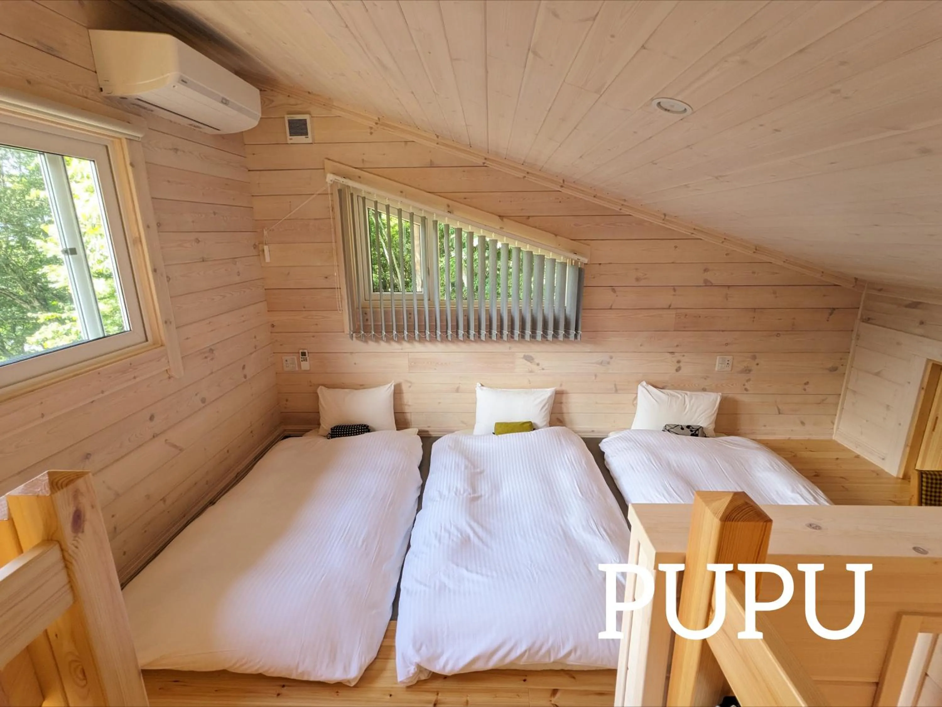 Bed in Log cabin rentals & Finland sauna Step House