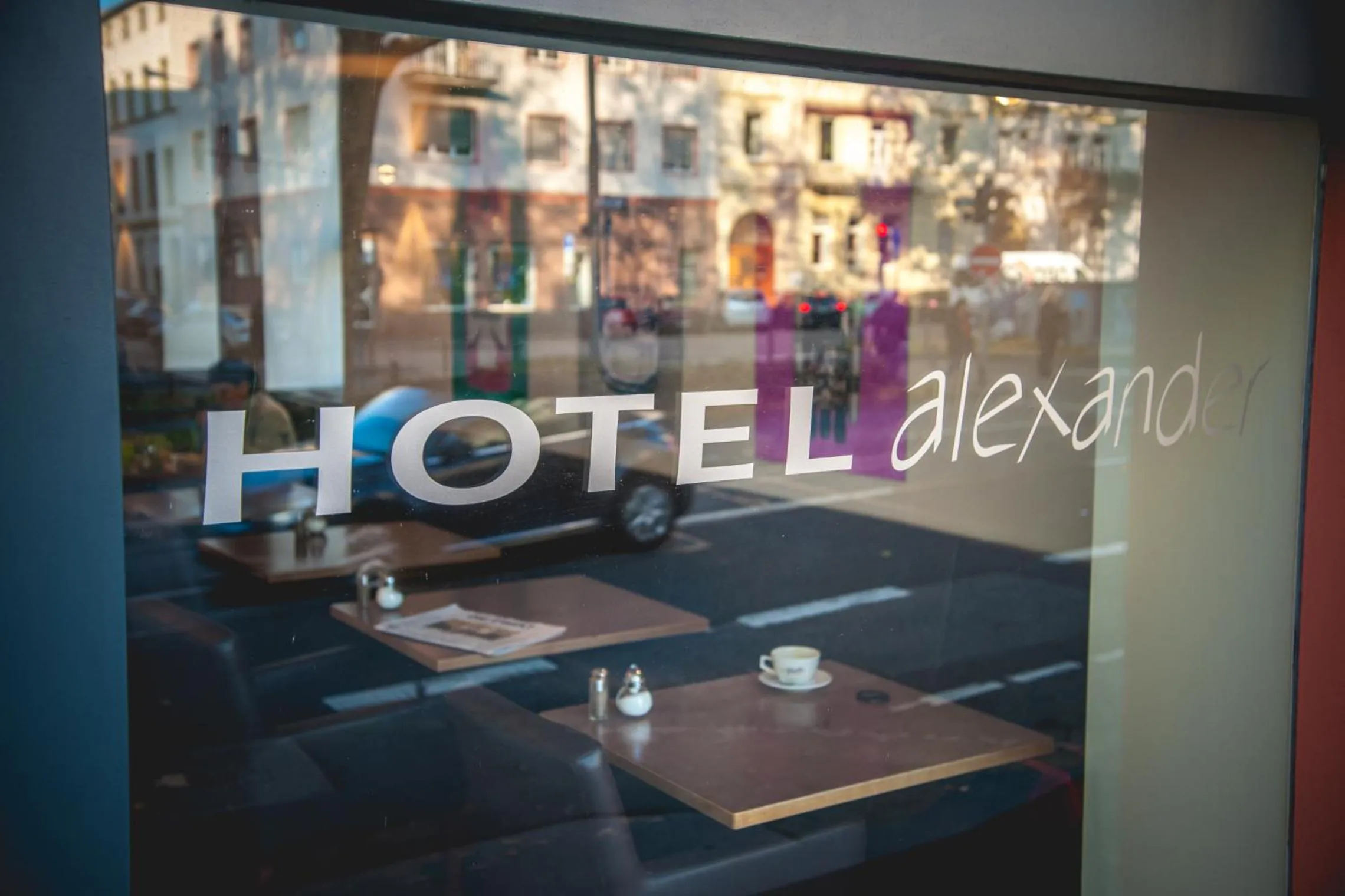 Property logo or sign in Hotel Alexander