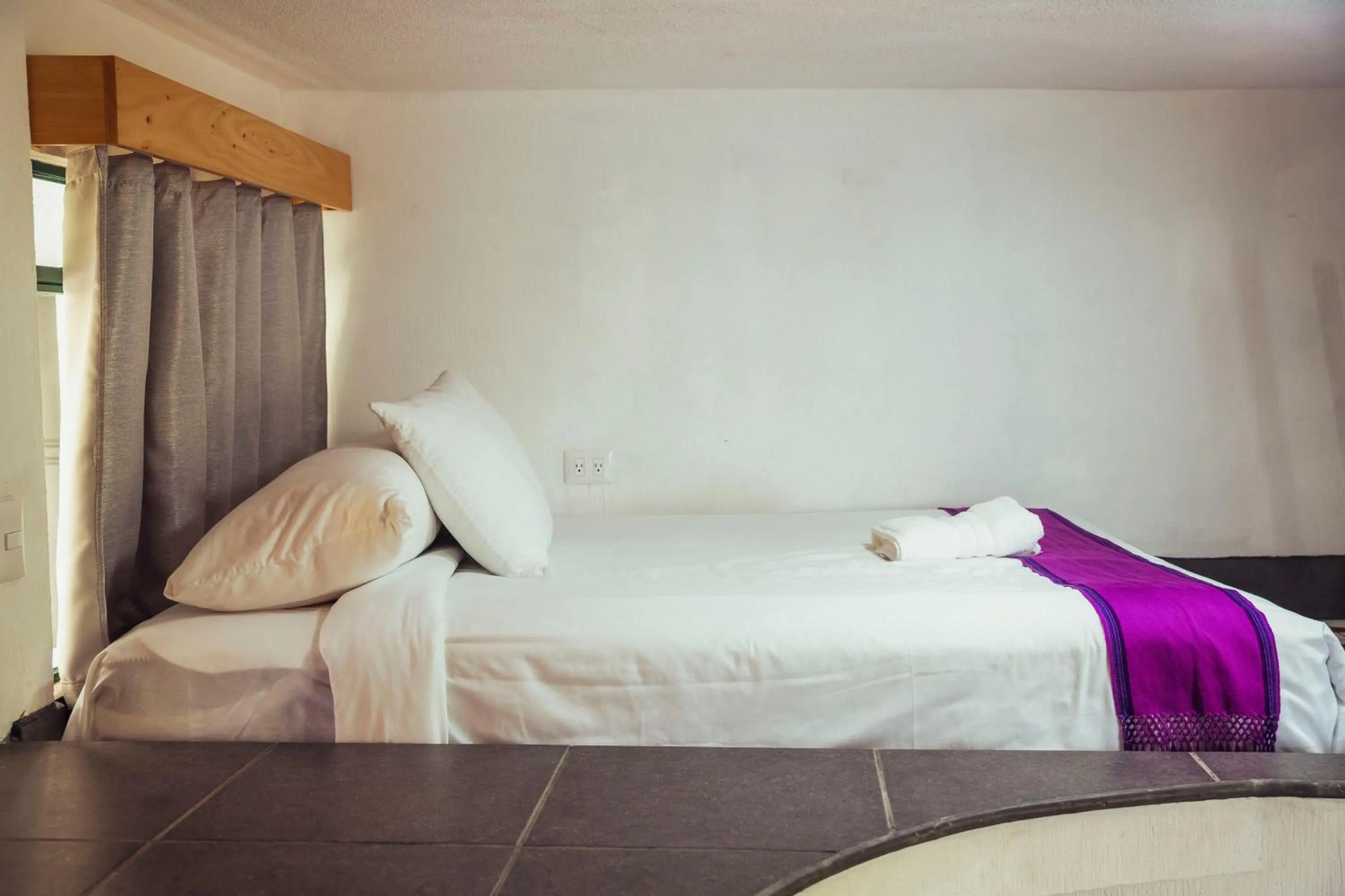 Bed in El Dragon Hotel