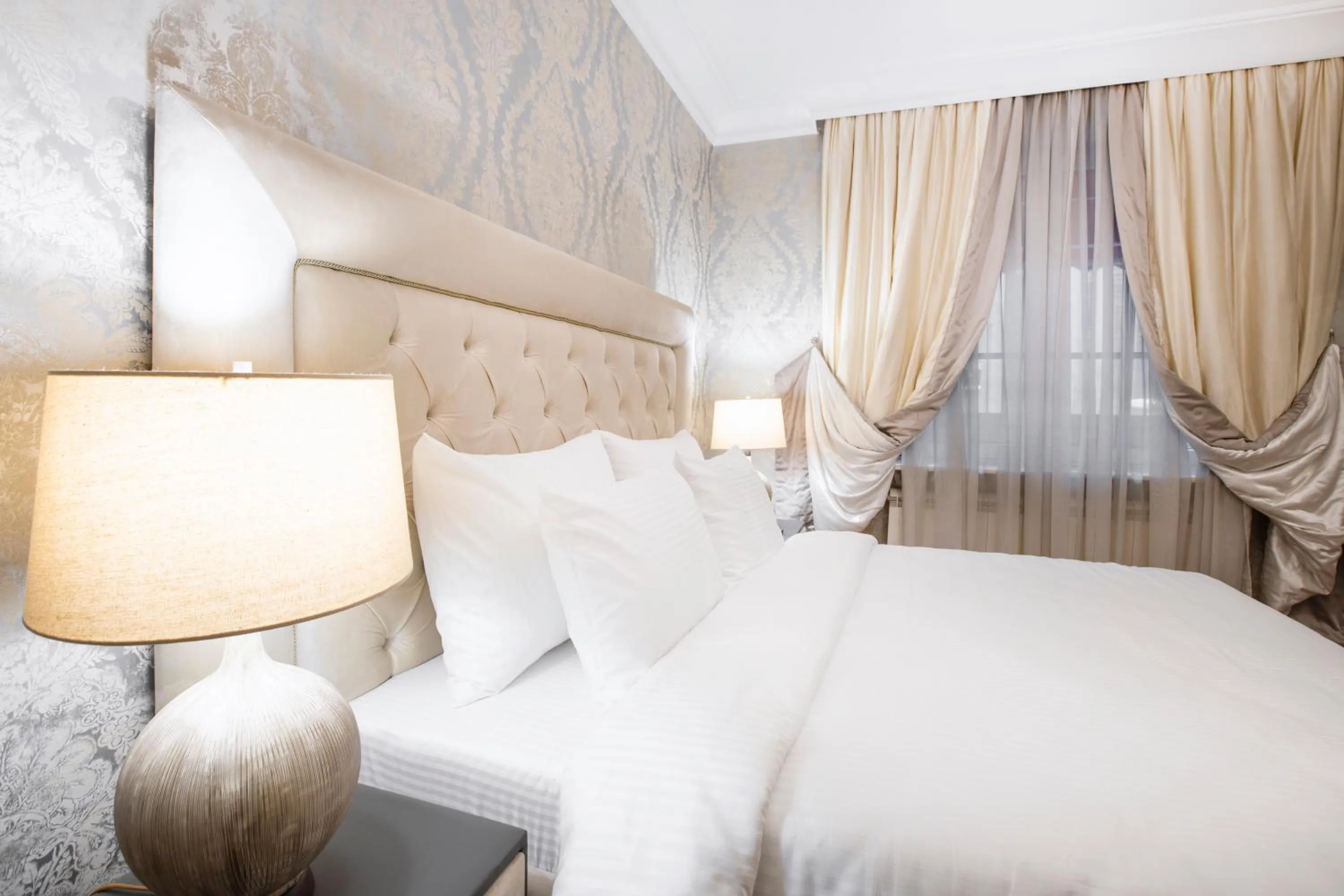 Bed in Eclat Luxury Hotel