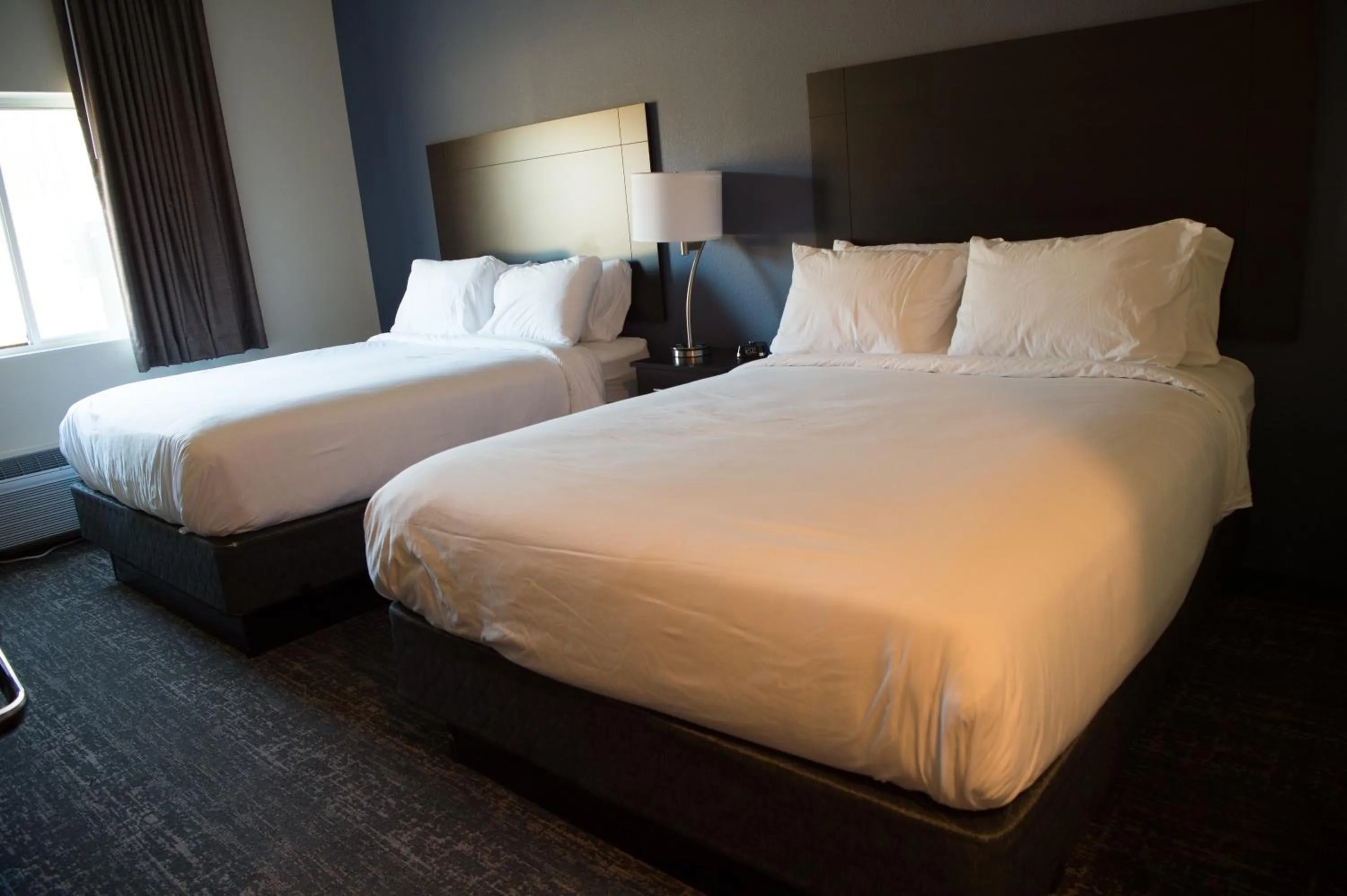 Bed in Cobblestone Inn & Suites - Forest City