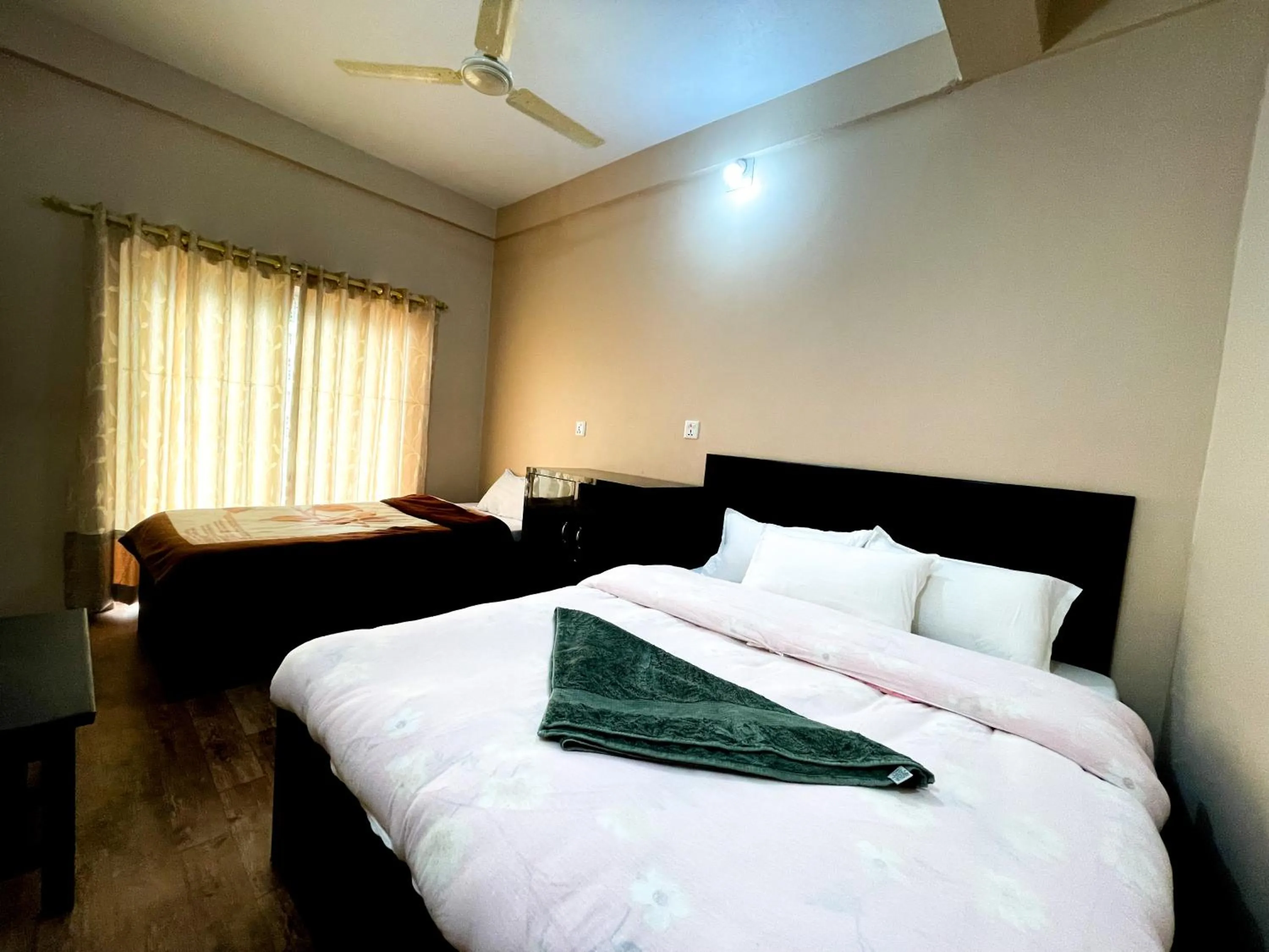 Bed in Yuriko Guest House