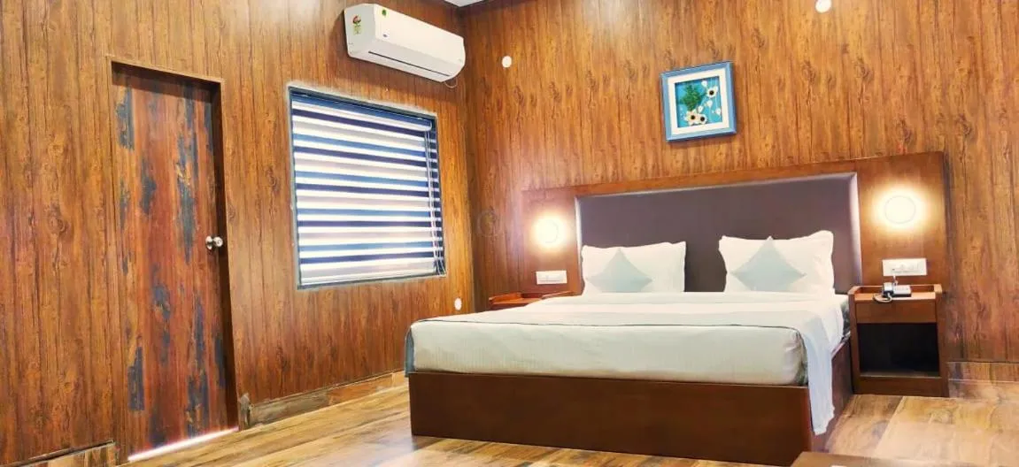 Bed in Aranya Resort by Mrugavani