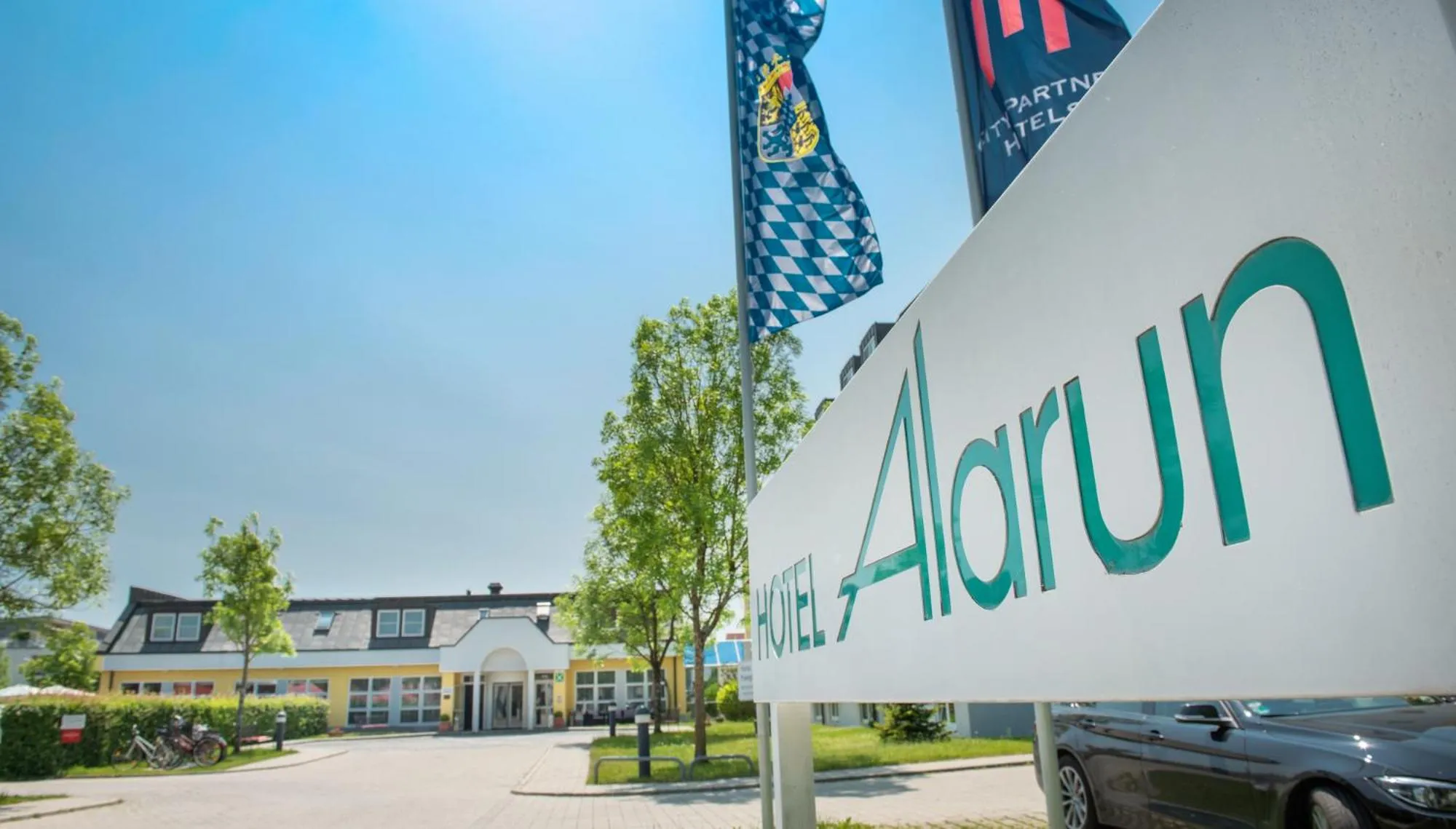 Property logo or sign in Hotel Alarun