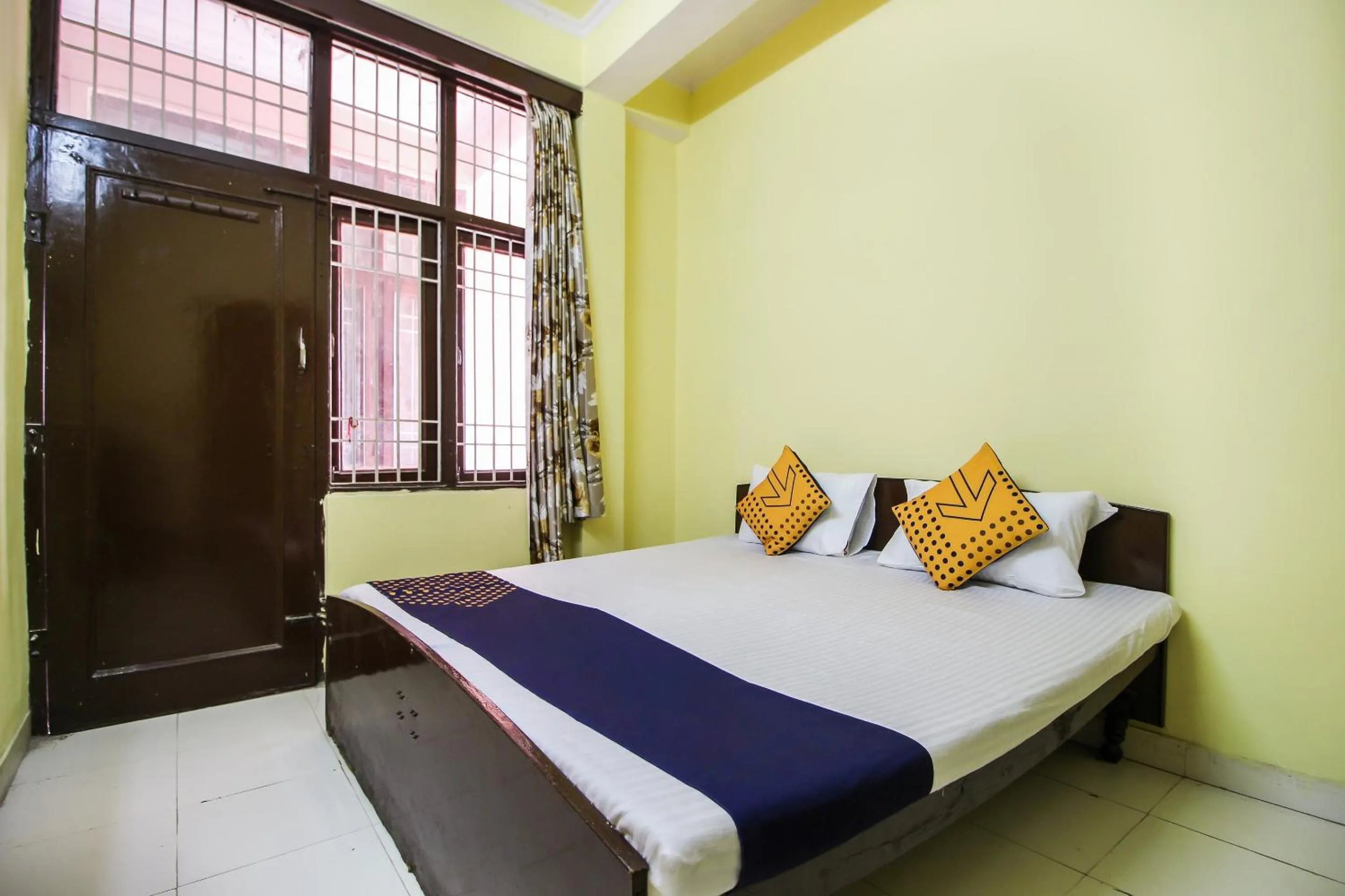 Bedroom in Collection O Hotel Kavya Guest House