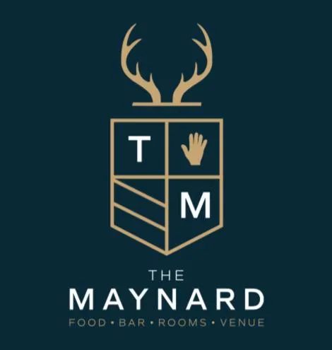 Property logo or sign in The Maynard