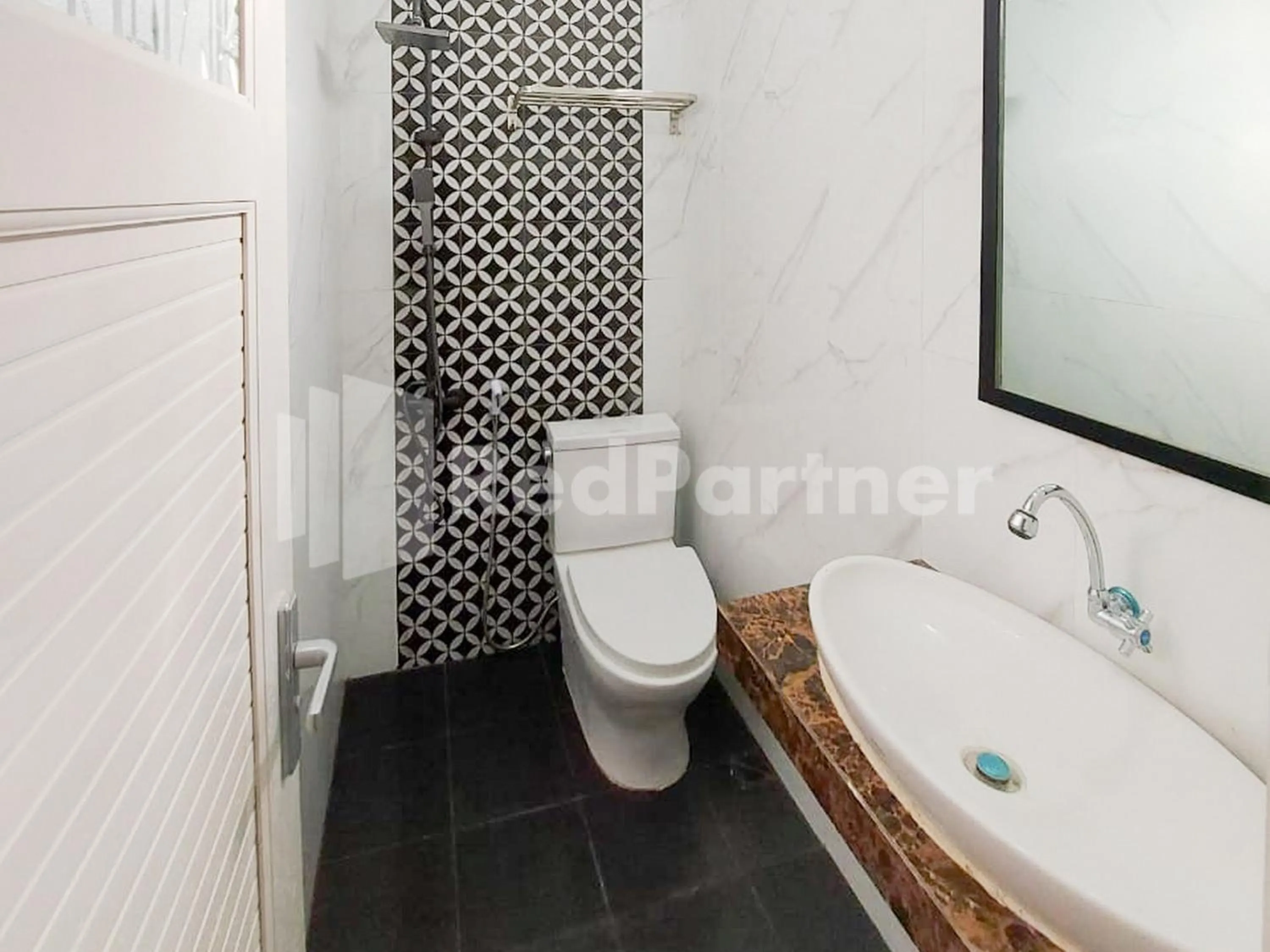 Bathroom in SPOT ON 2815 Hotel Damai