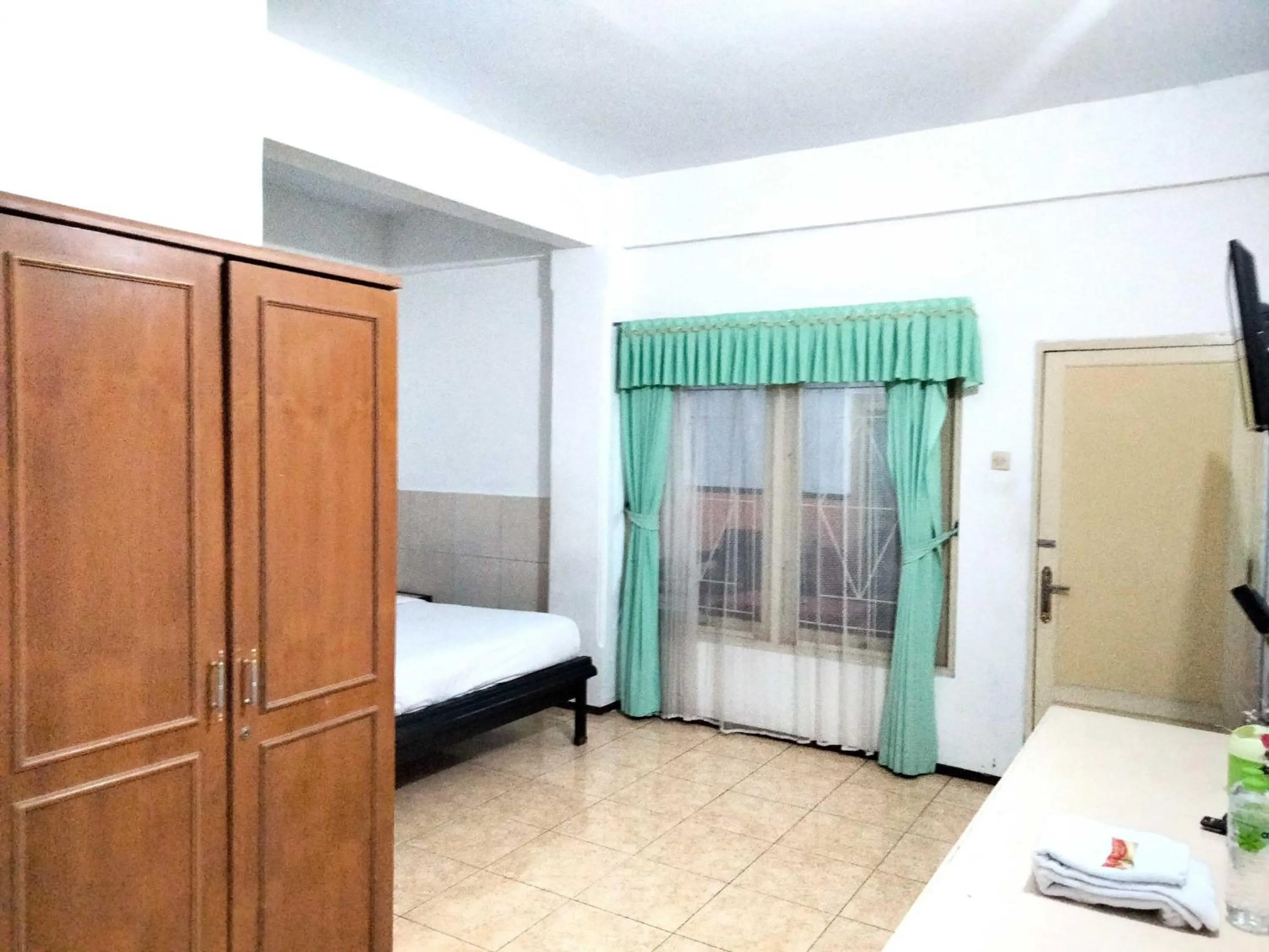 Bedroom, Bed in Sartika Hotel Mitra RedDoorz Pati