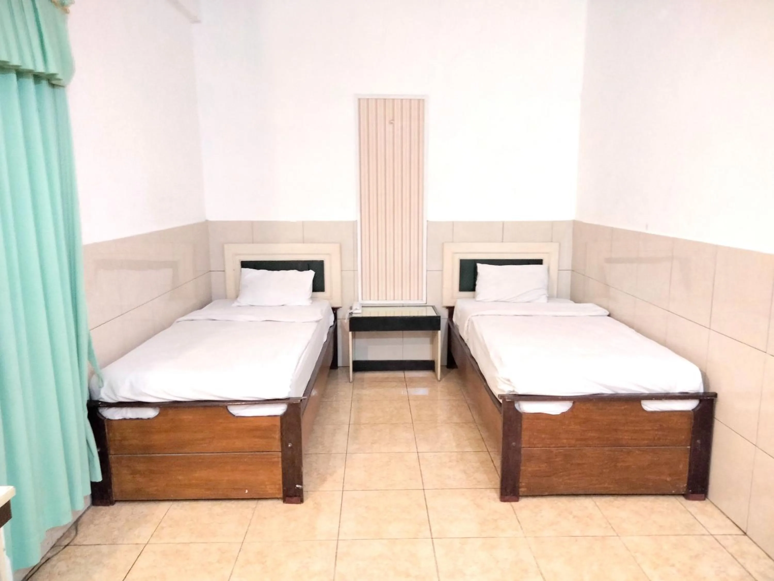 Bedroom, Bed in Sartika Hotel Mitra RedDoorz Pati