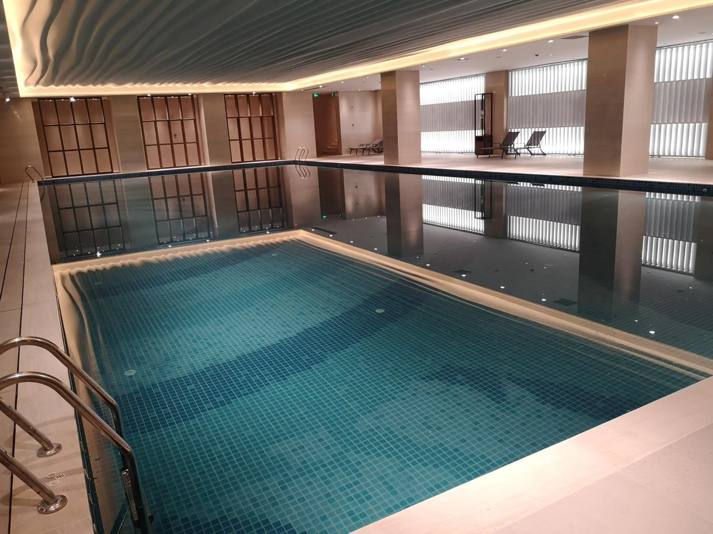 Swimming pool in Vignette Collection Haikou Yatter Hotel by IHG