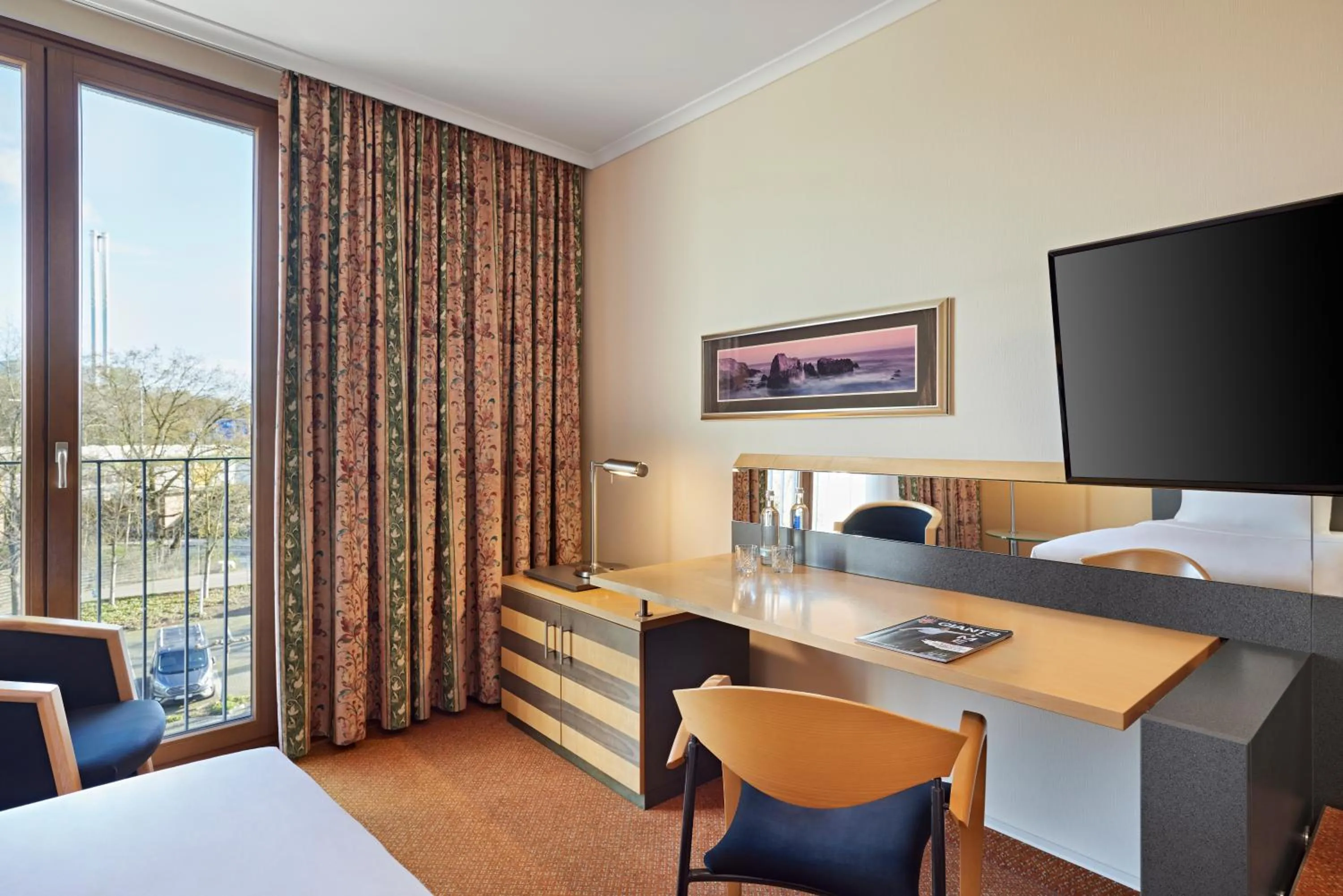 Communal lounge/ TV room, Bed in Lindner Hotel Leverkusen BayArena, part of JdV by Hyatt