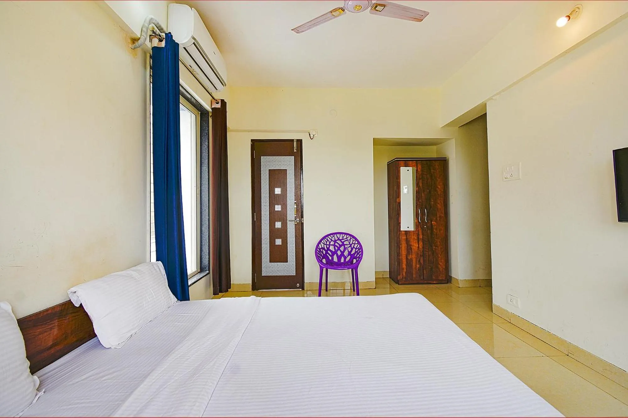 Bed in FabExpress Golden Leaf Airport