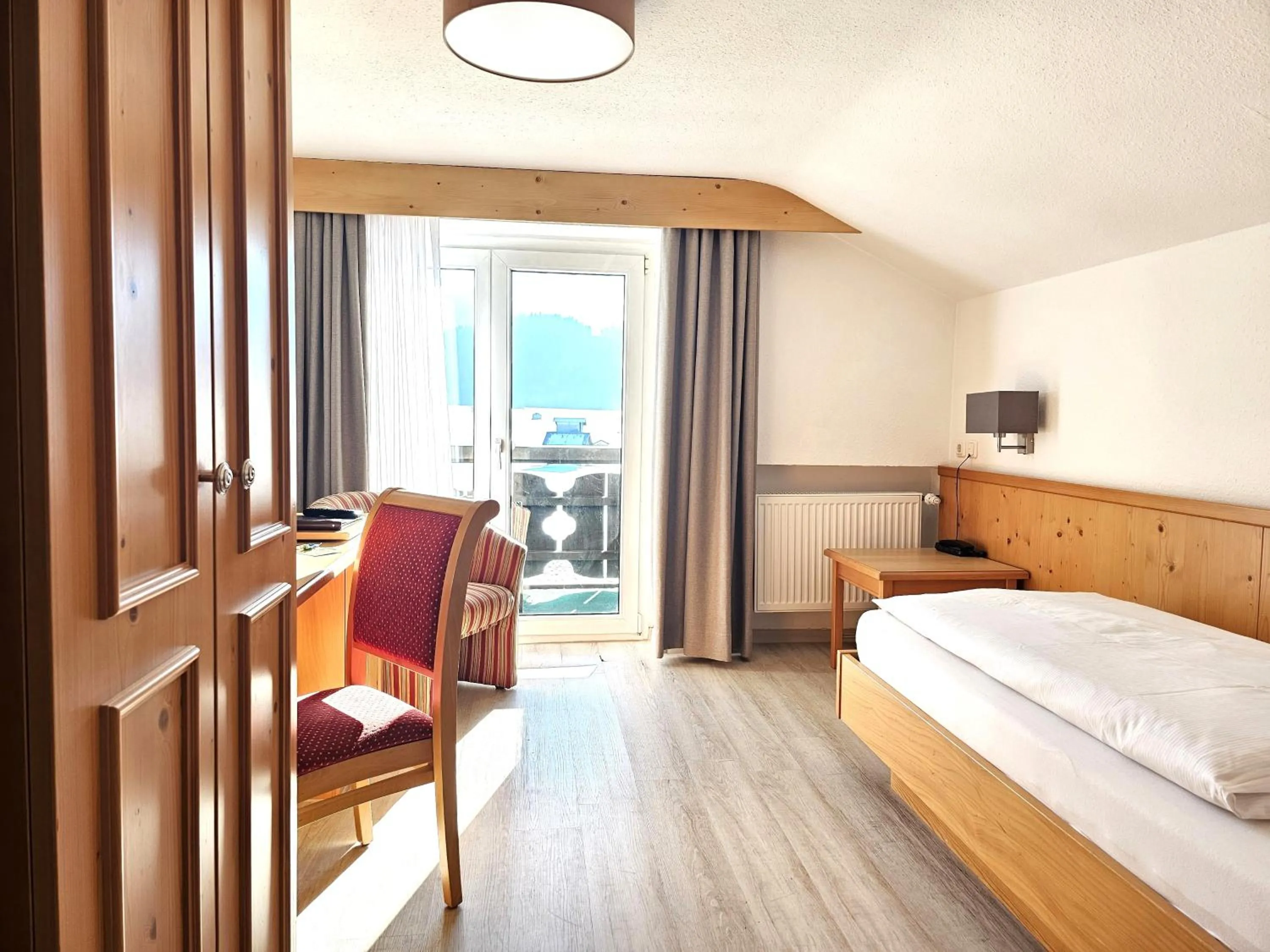 View (from property/room), Bed in Hotel Cafe Fuggerhof