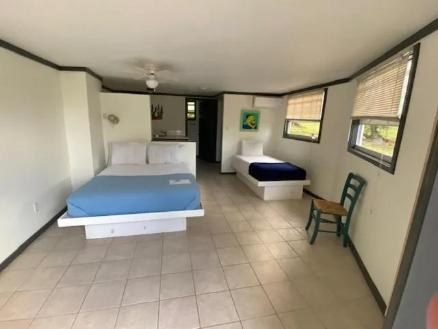 Bed in The Sunset Cove and Rainbow Room