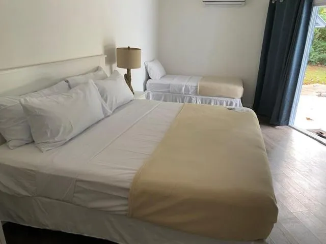 Bed in The Sunset Cove and Rainbow Room