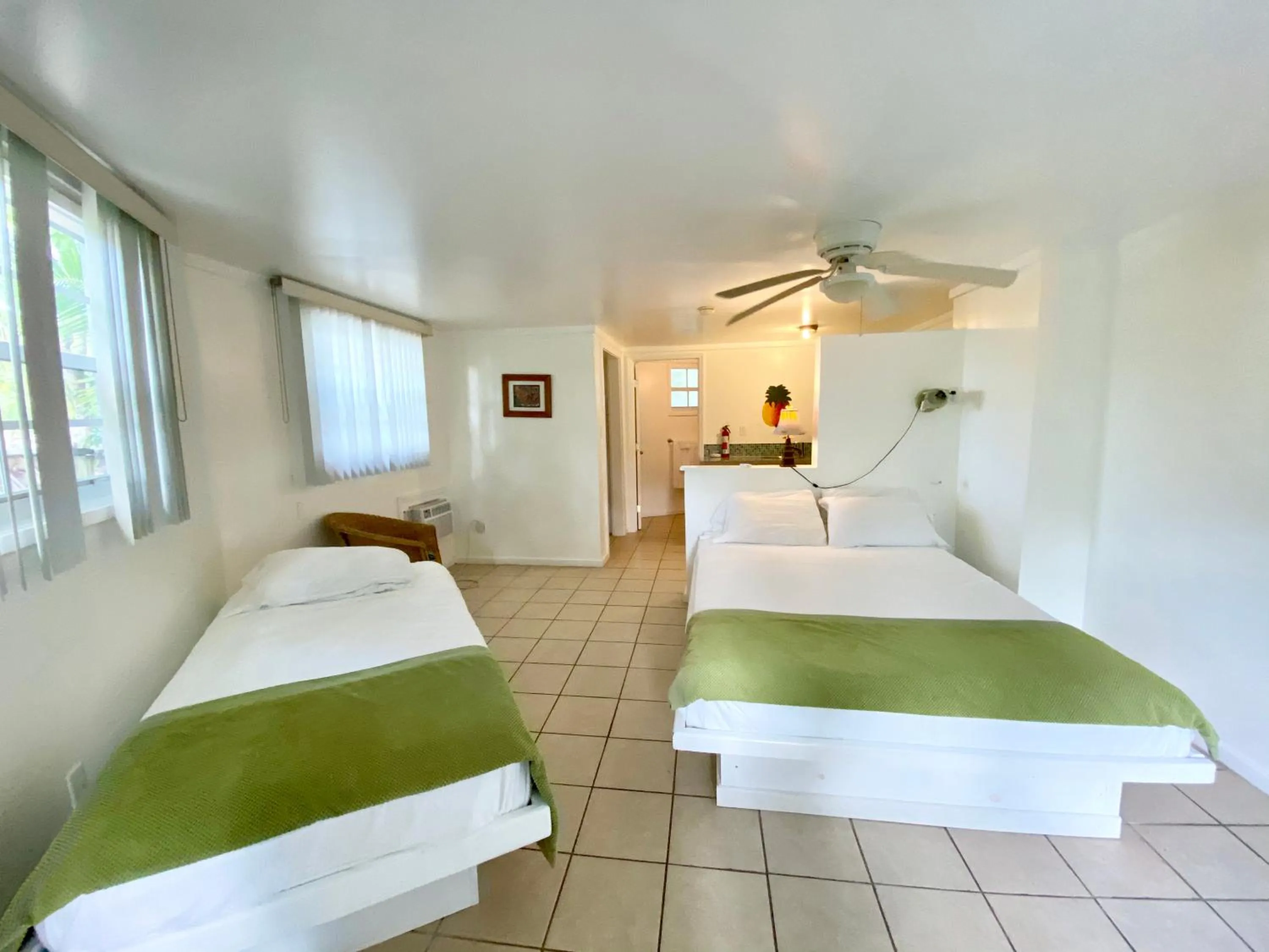 Bed in The Sunset Cove and Rainbow Room