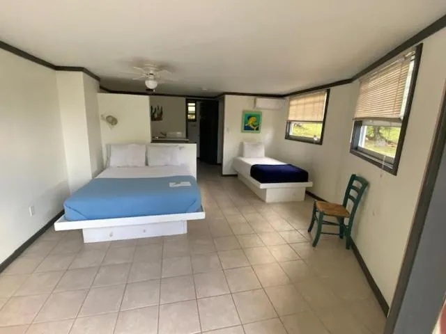 Bed in The Sunset Cove and Rainbow Room