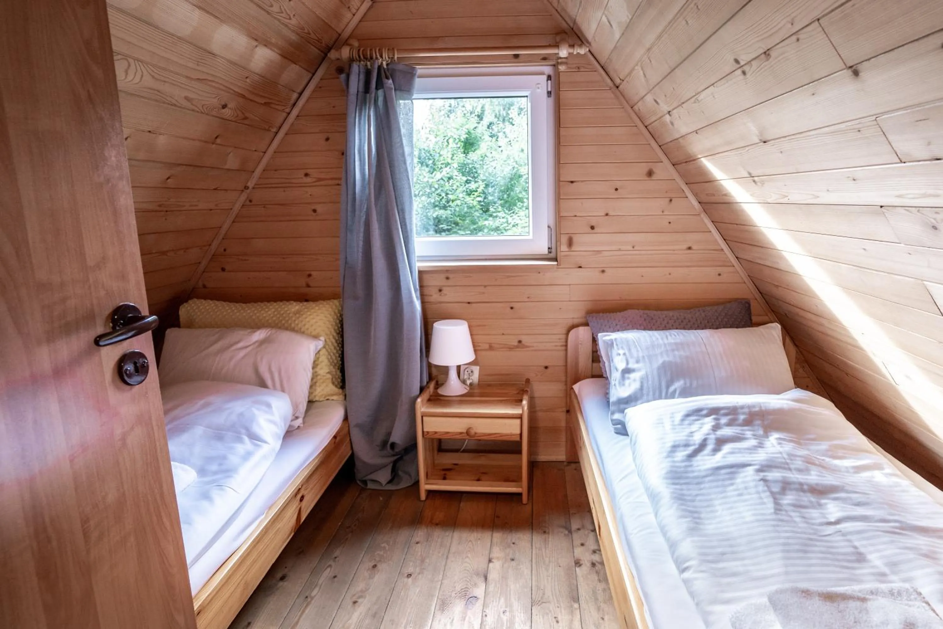 Bed in Pod Cyprysami - surf & family resort