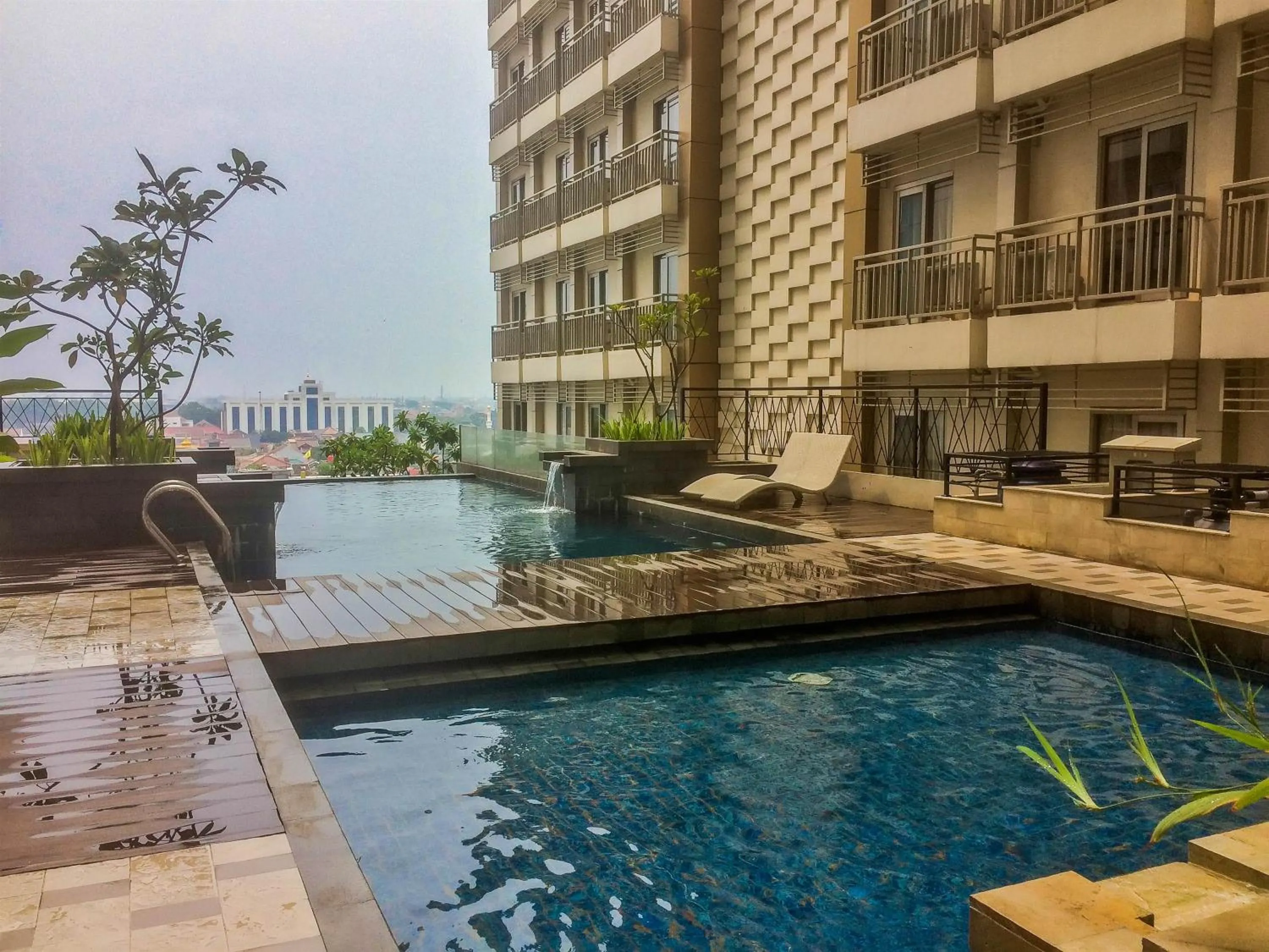 Swimming pool in Highest Value Studio Room at Annora Living Apartment By Travelio