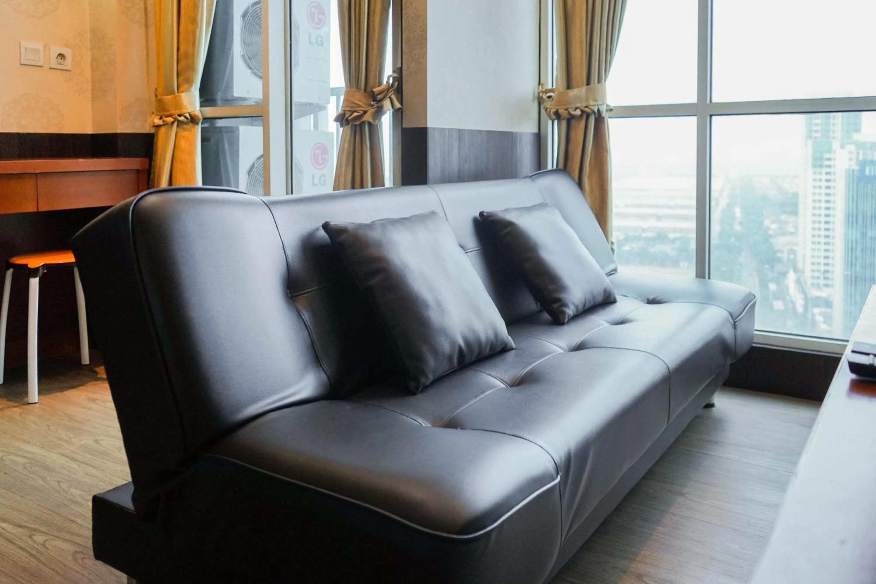 Living room in Best Price 2BR at Tifolia Apartment By Travelio