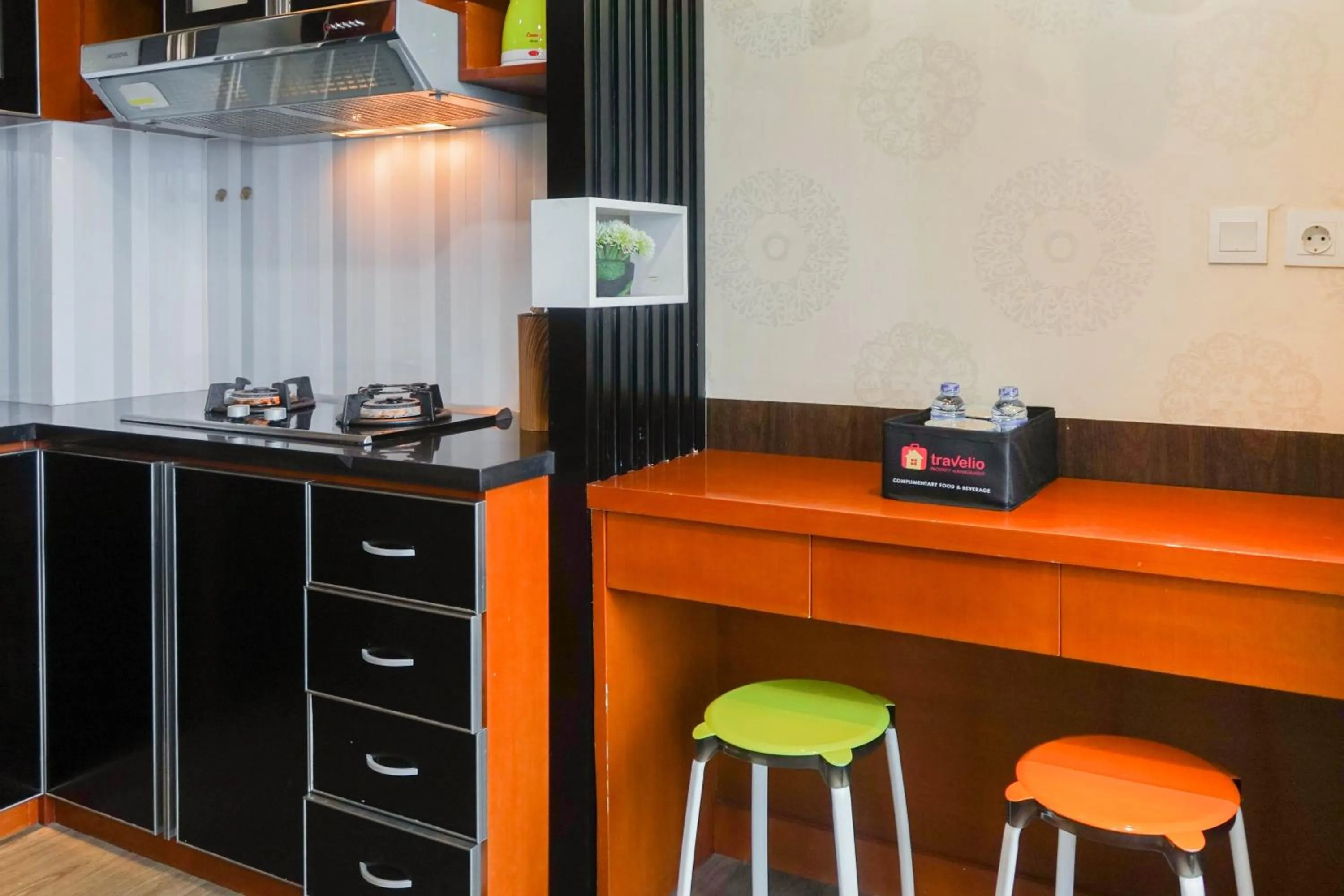 Kitchen or kitchenette in Best Price 2BR at Tifolia Apartment By Travelio