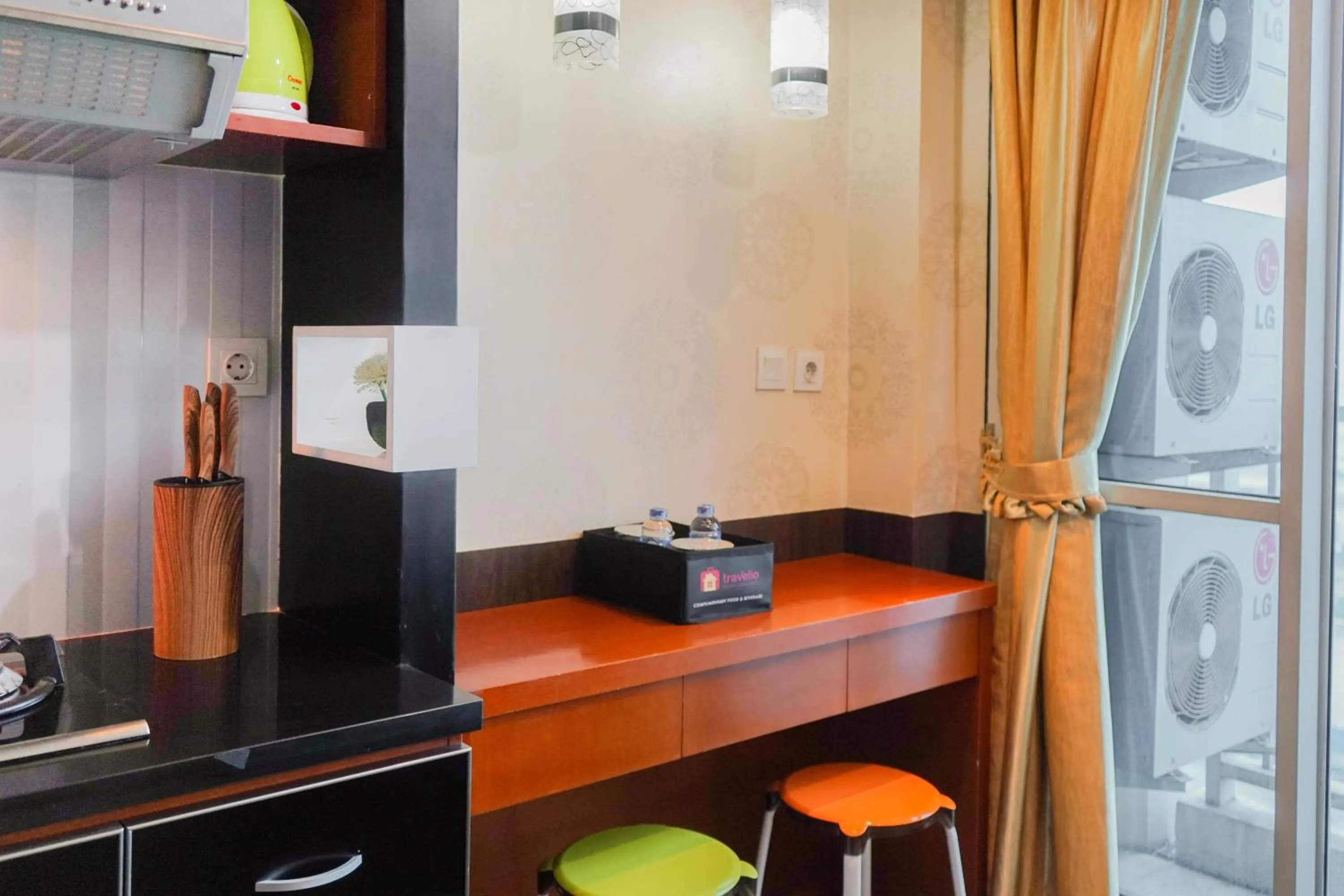 Kitchen or kitchenette in Best Price 2BR at Tifolia Apartment By Travelio