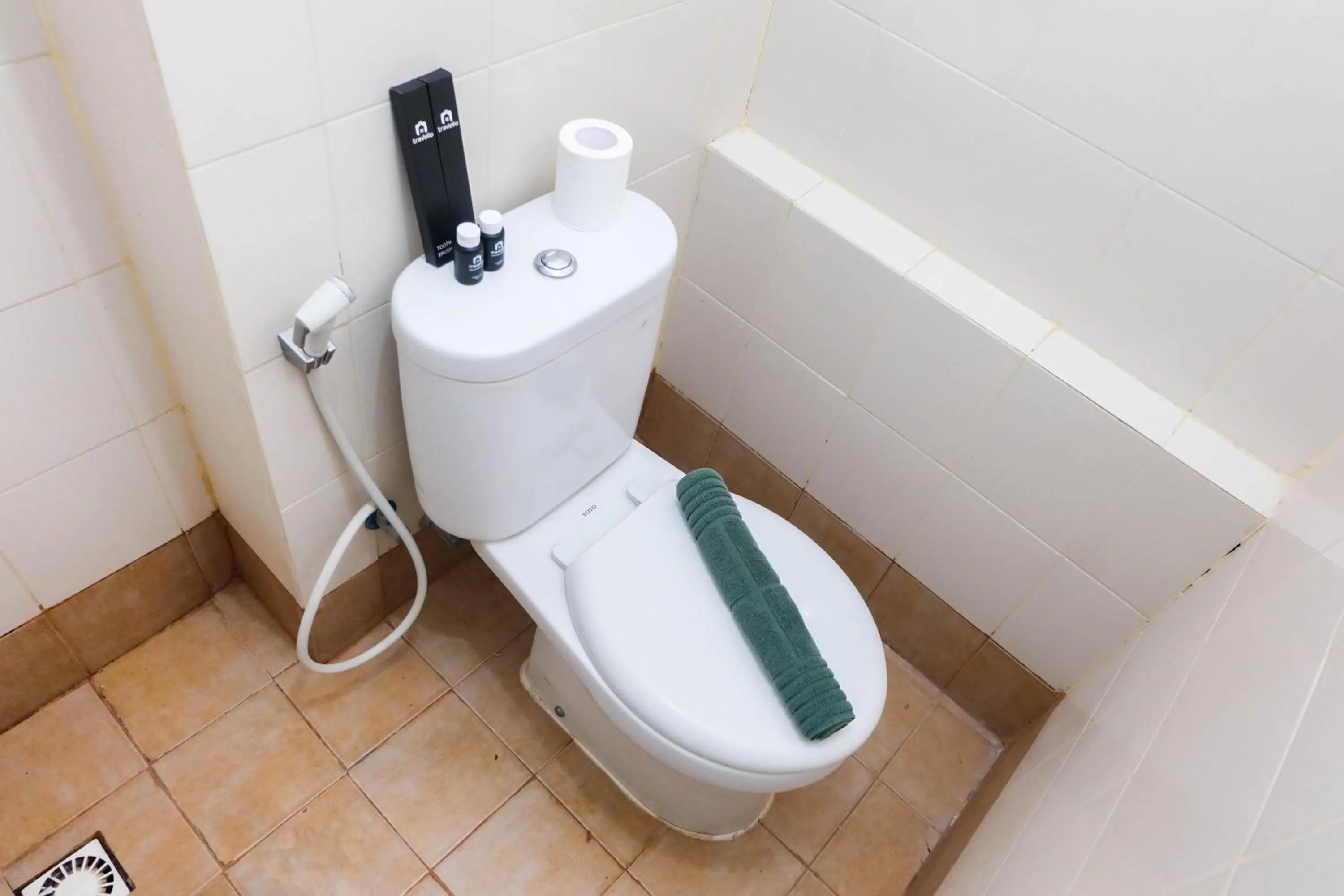 Bathroom in Tidy Studio Apartment at Bassura City near Shopping Mall By Travelio