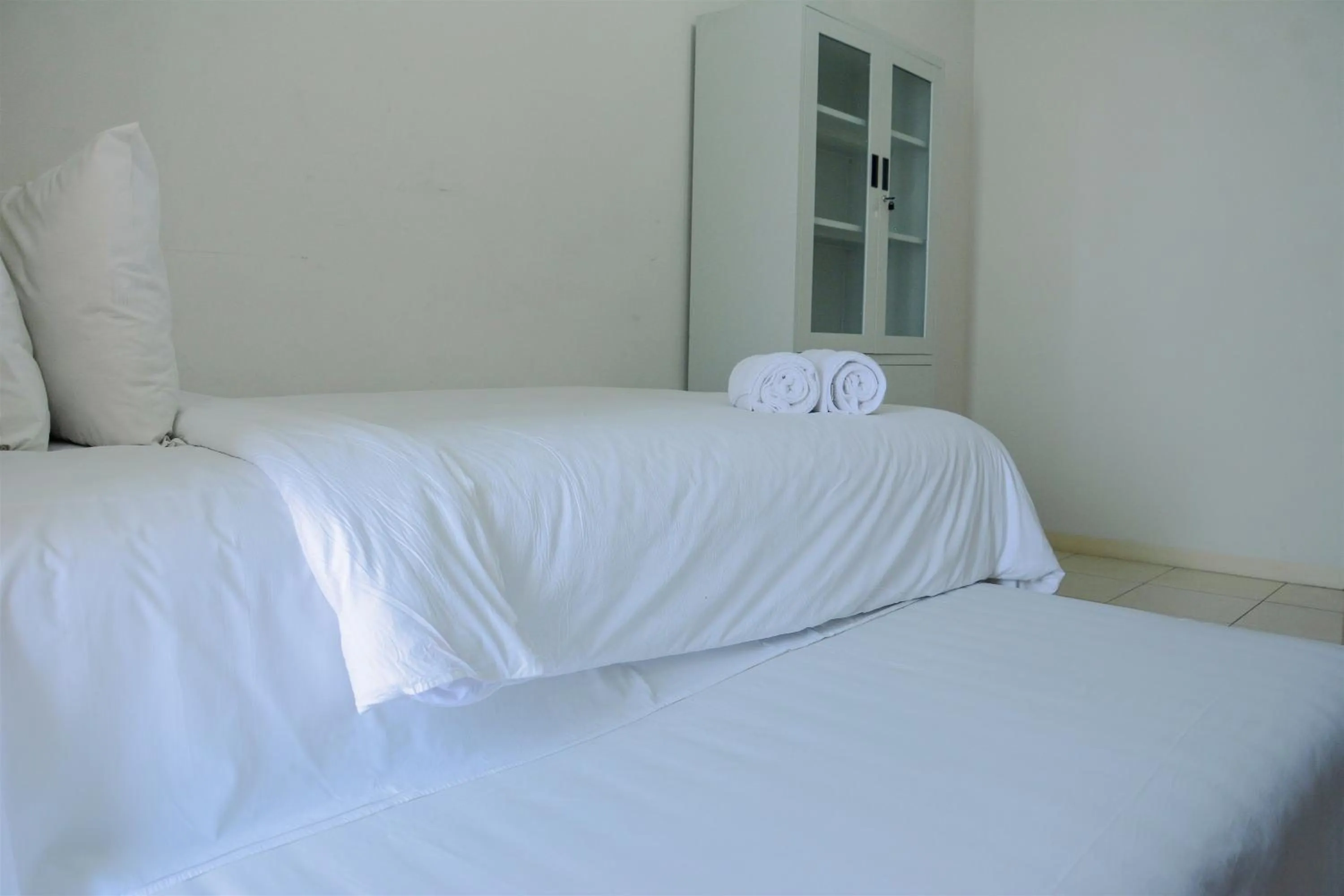 Bed in Cozy Studio Apartment at Margonda Residence 4 By Travelio