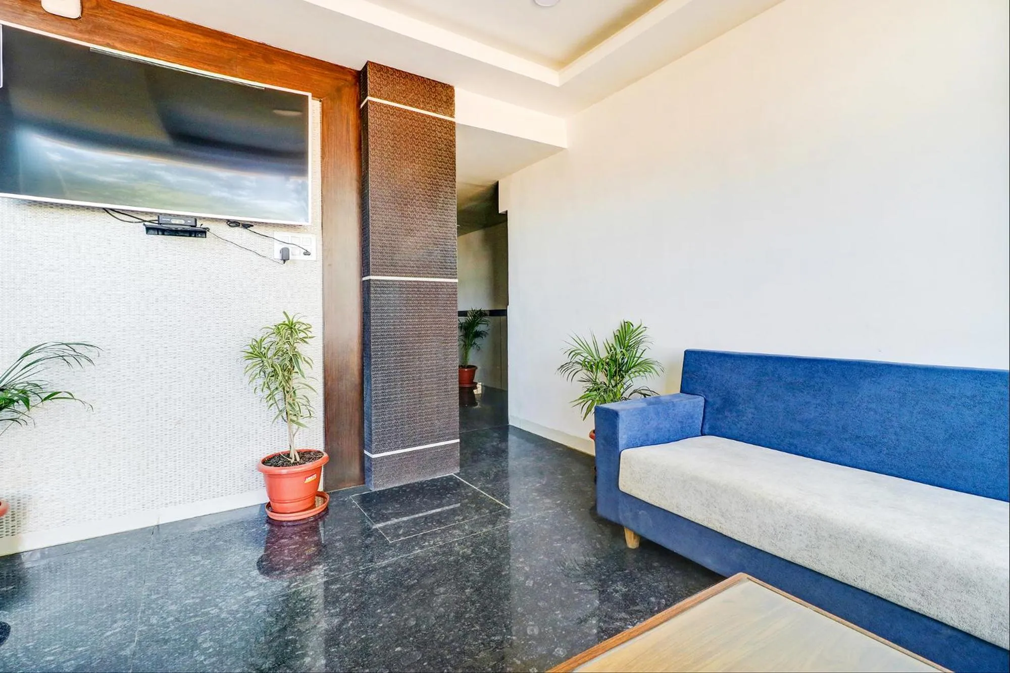 Seating area, Bed in FabHotel Meera Palace