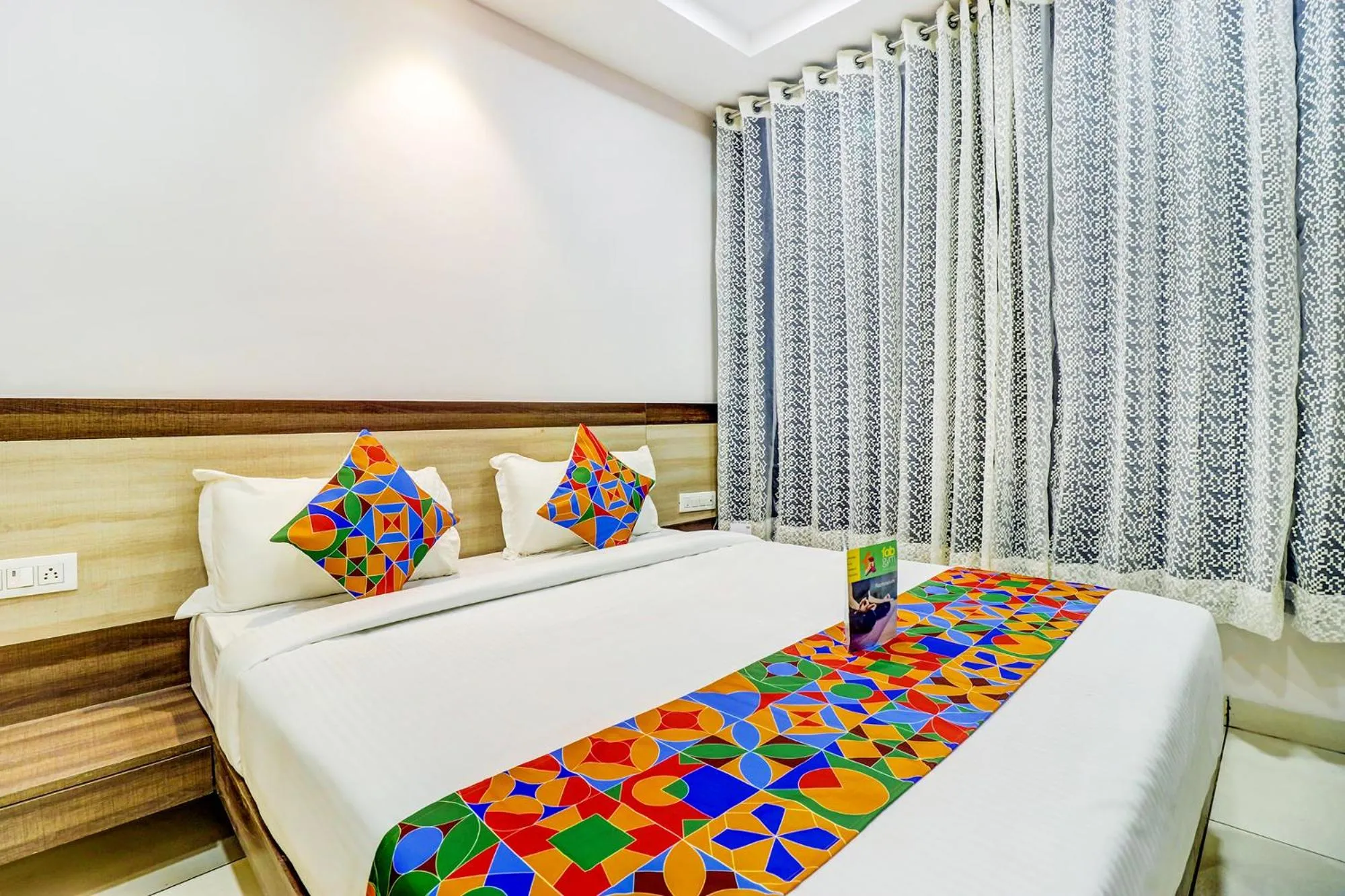 Bed in FabHotel Meera Palace