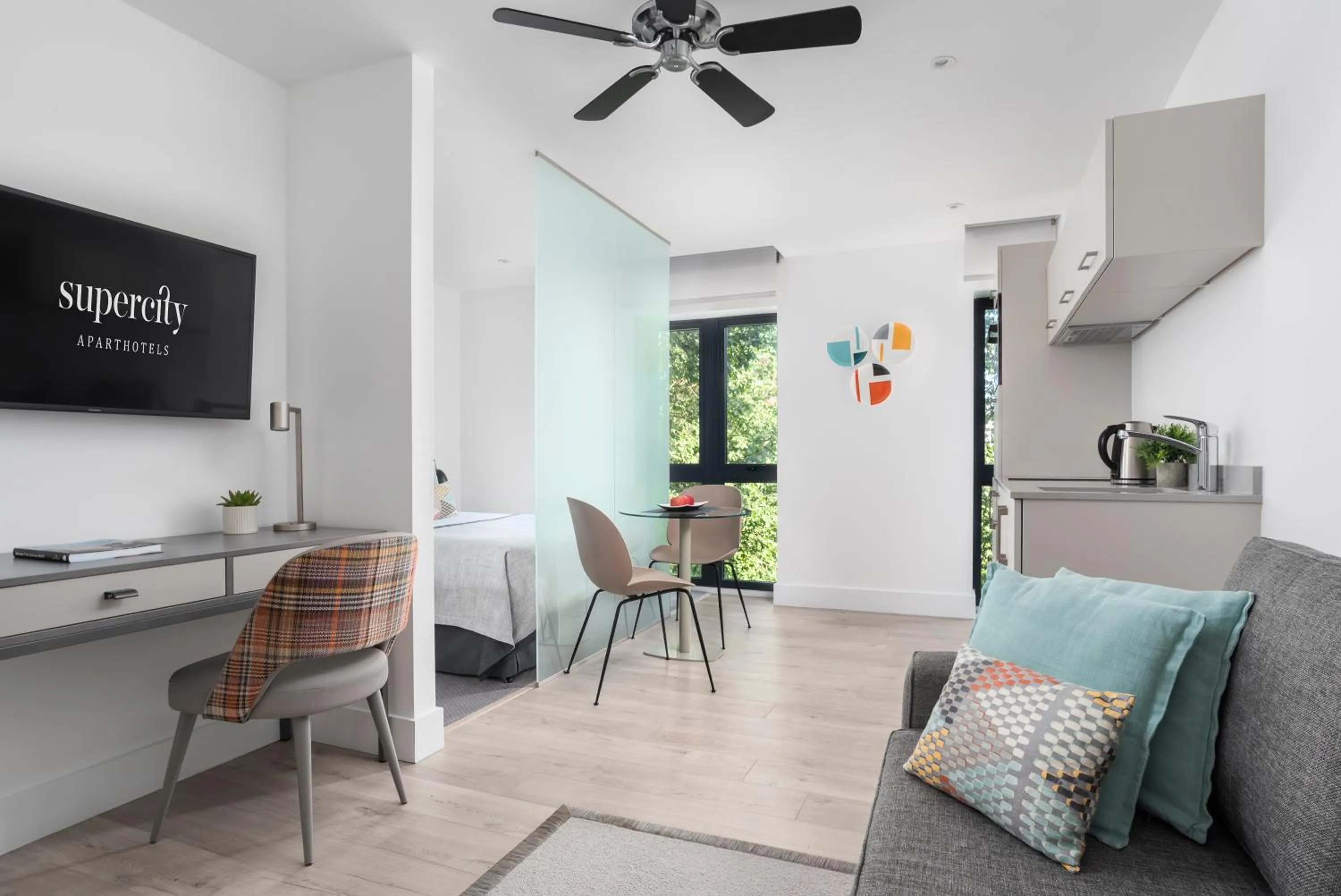 Living room, Bed in Q Square by Supercity Aparthotels