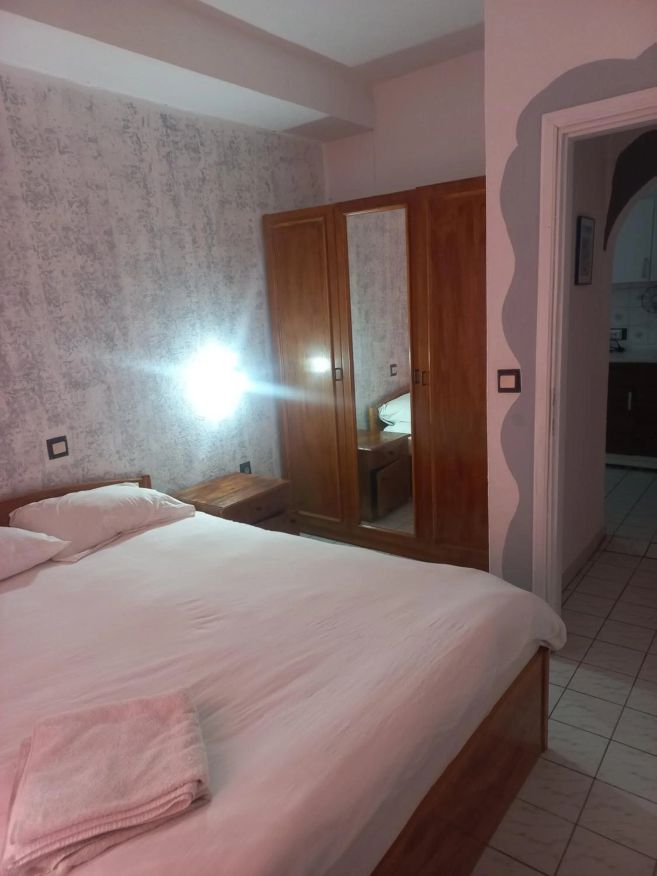 Bed in Delphin Apart Hotel