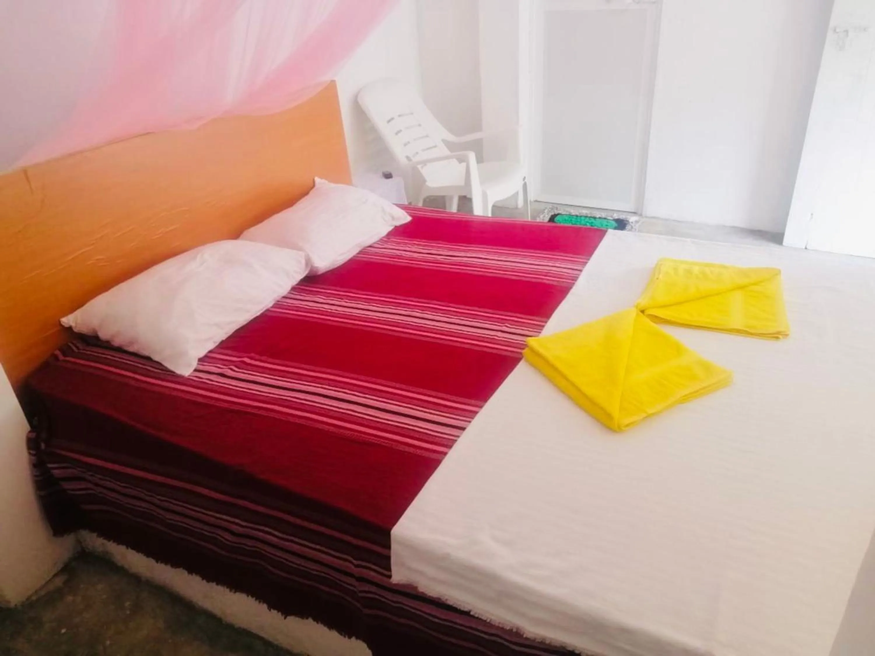 Bed in Hiriketiya Orchid Villa