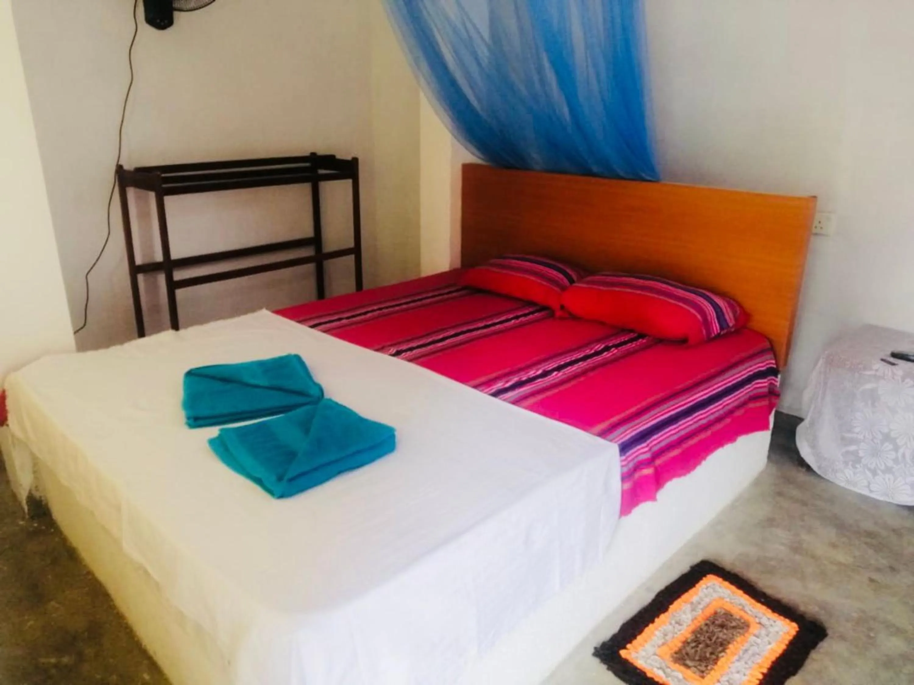 Bed in Hiriketiya Orchid Villa