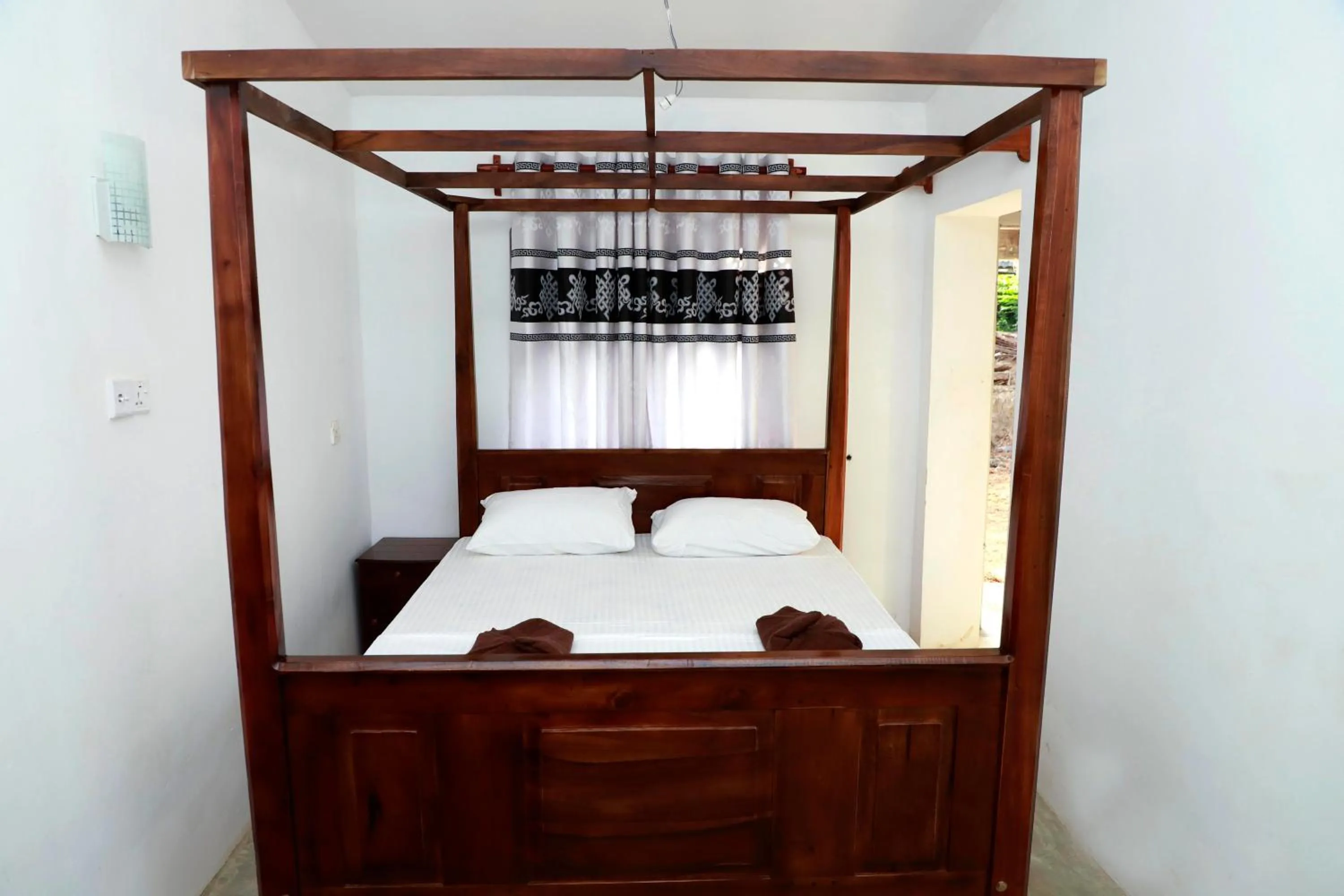 Bed in Hiriketiya Orchid Villa