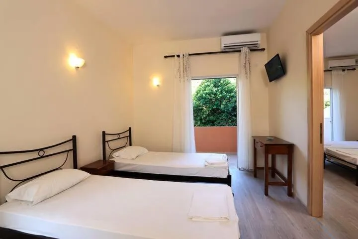 Bedroom in Villa Rosa Apartments