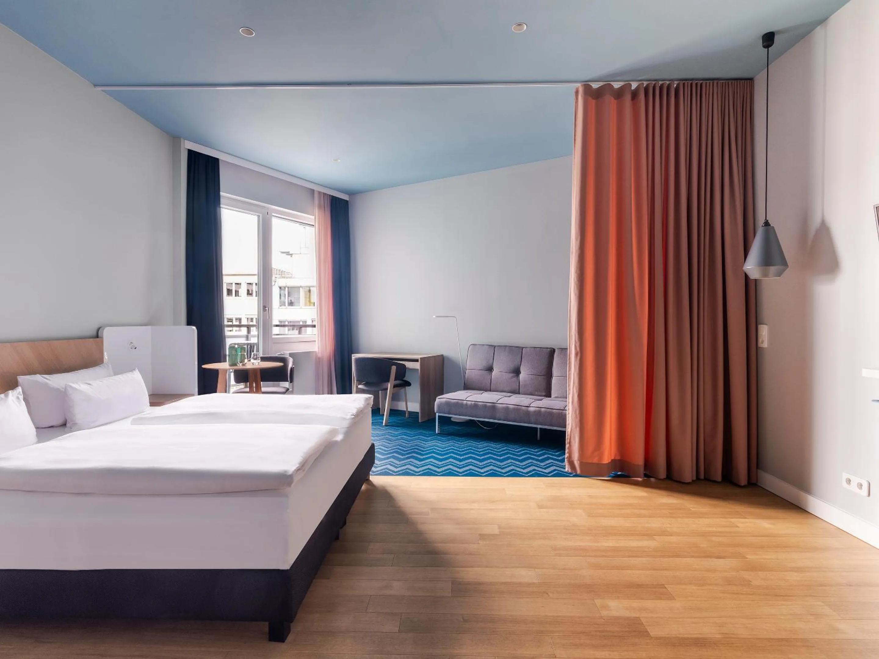 Bed in about:berlin Hotel