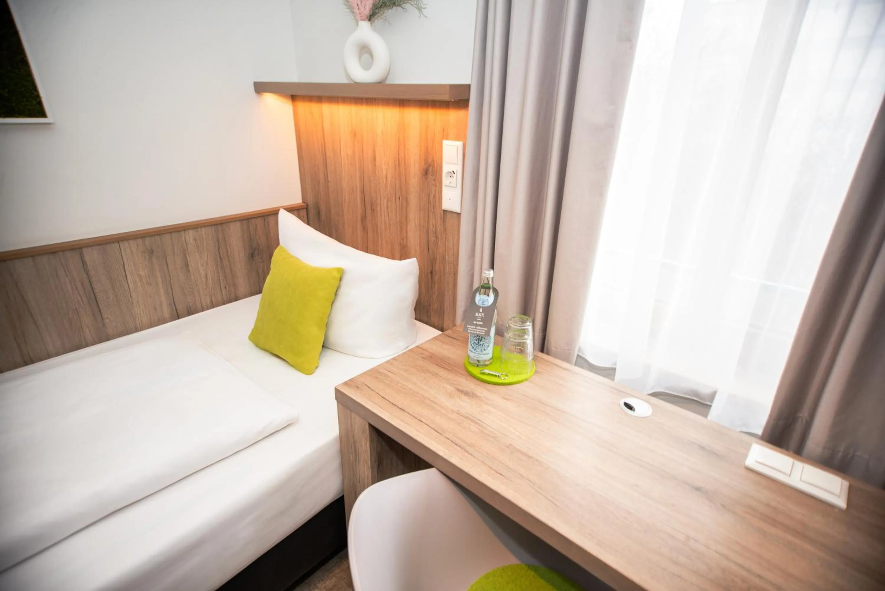 Decorative detail, Bed in Hotel Perlach Allee by Blattl